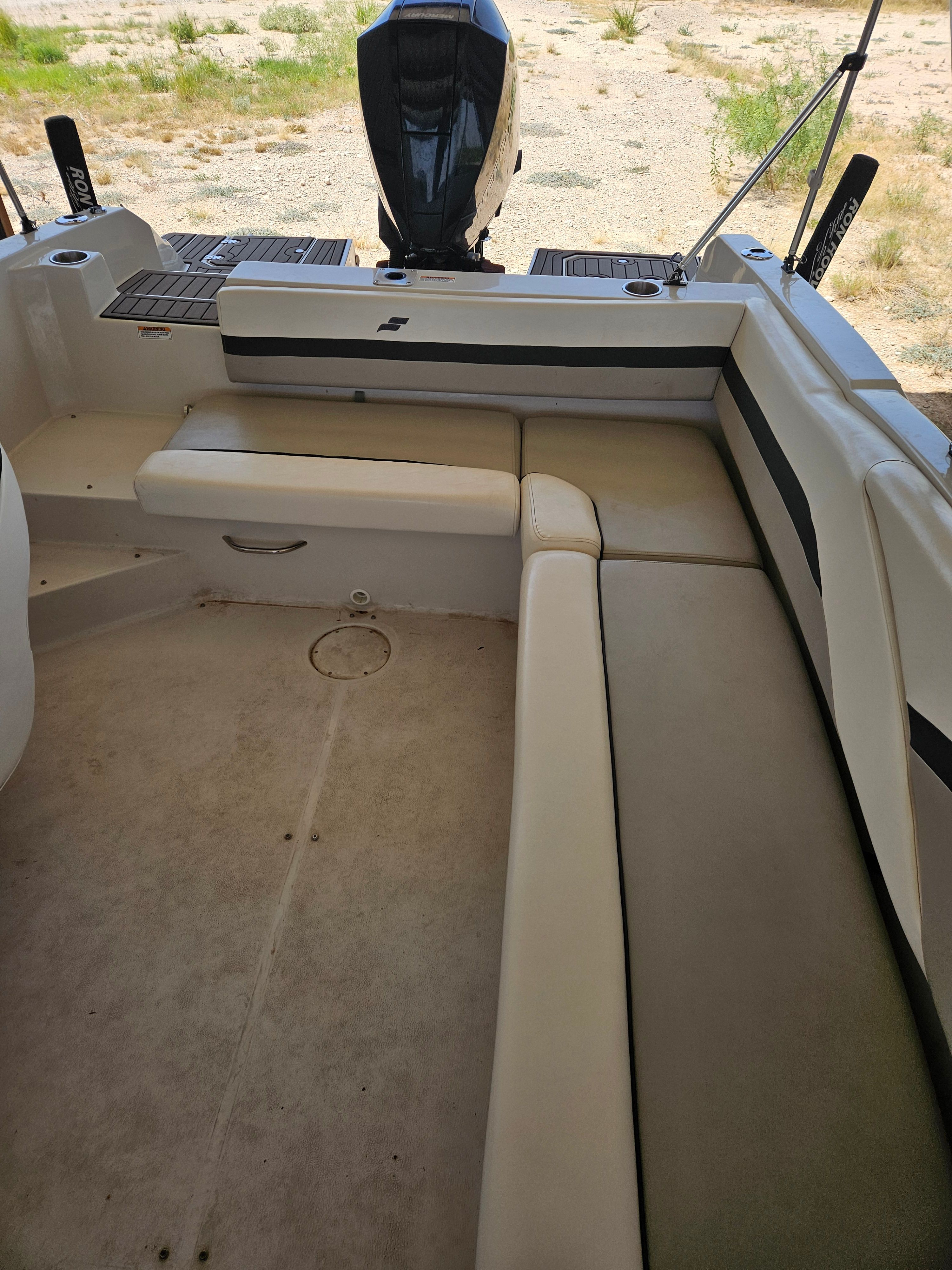 The image shows the interior of a 2023 Starcraft SVX211 boat with beige seating.