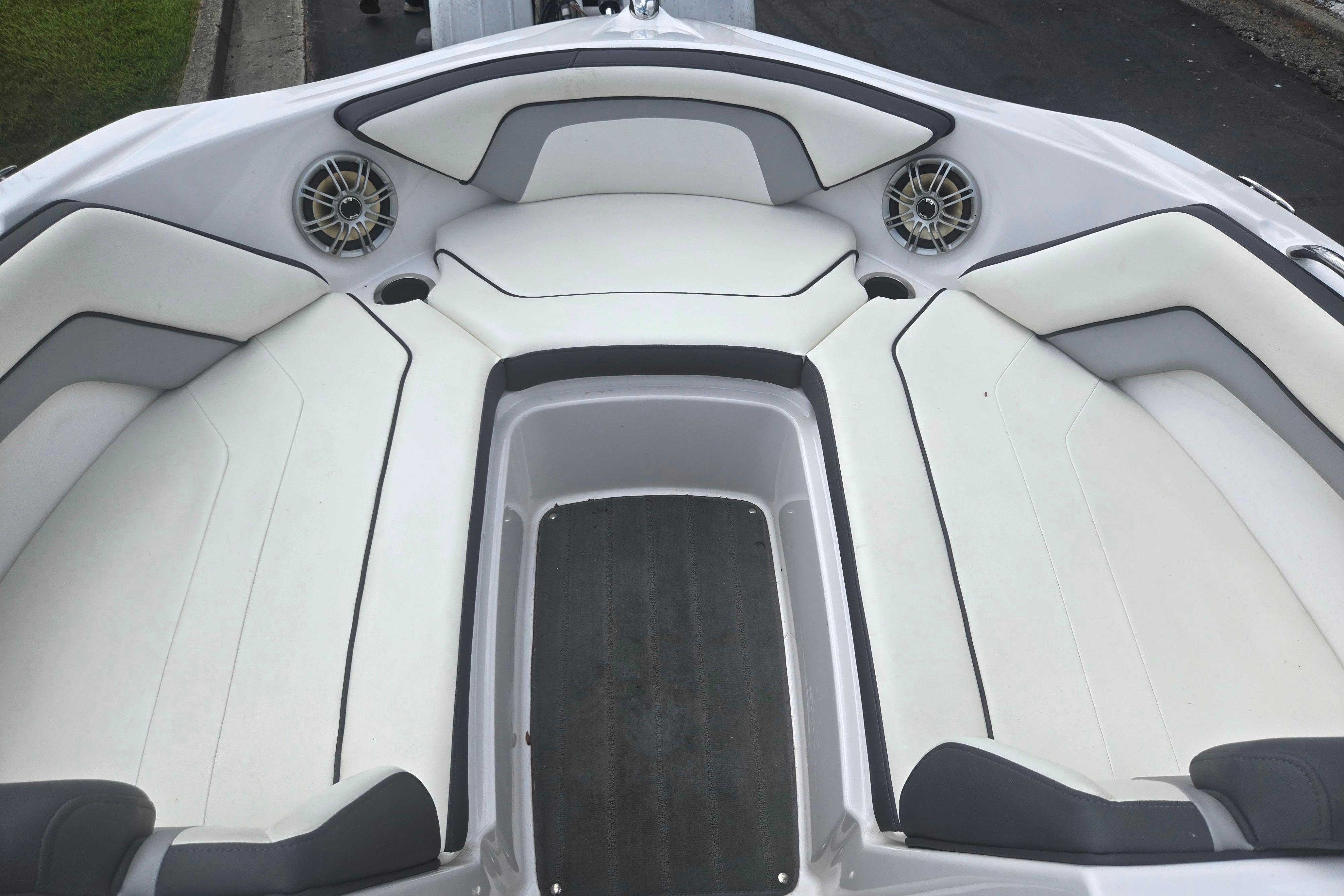 2016 Yamaha Boats AR192 interior with white cushioned seating and speakers.