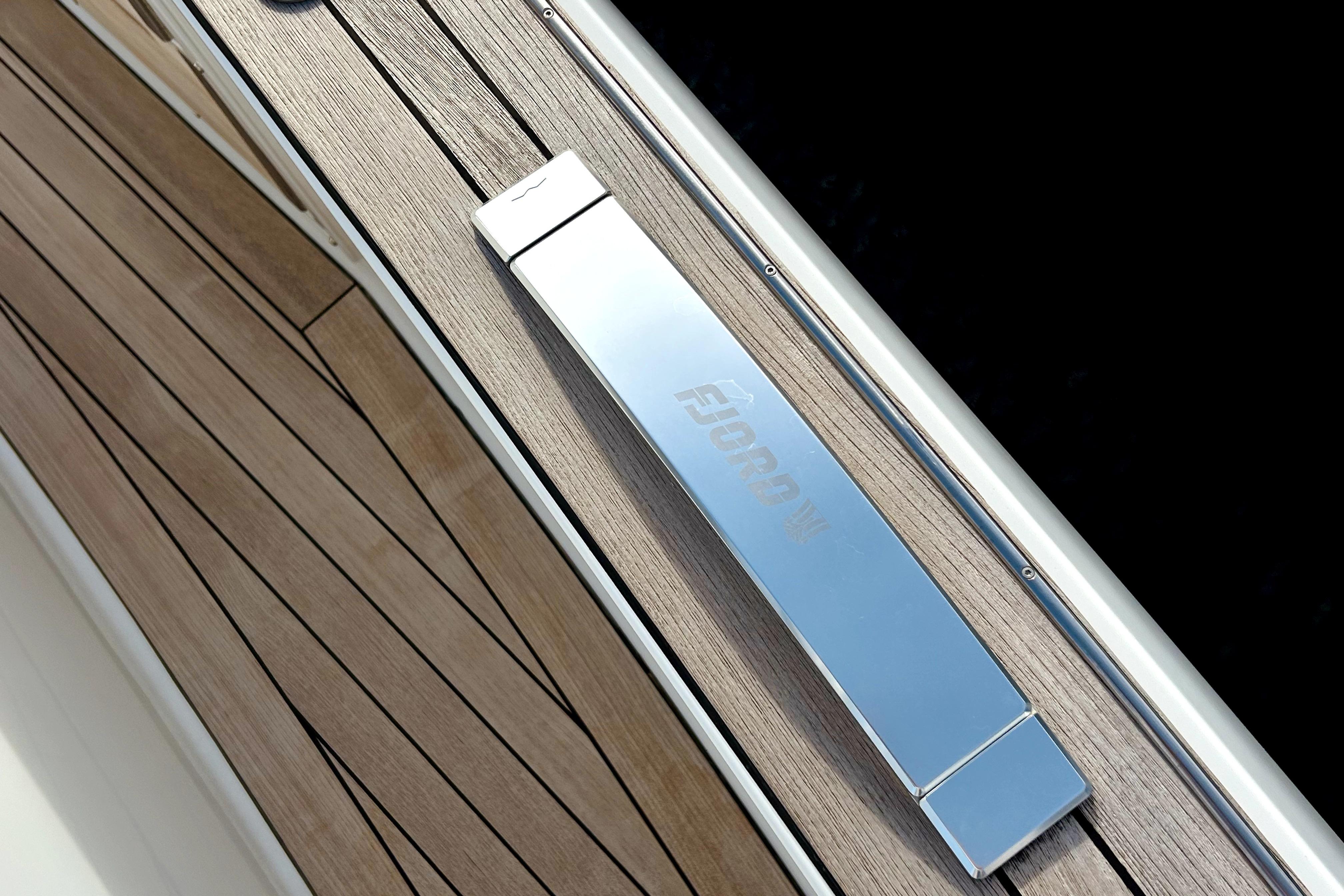 2023 Fjord 53 XL yacht deck with sleek chrome detailing.