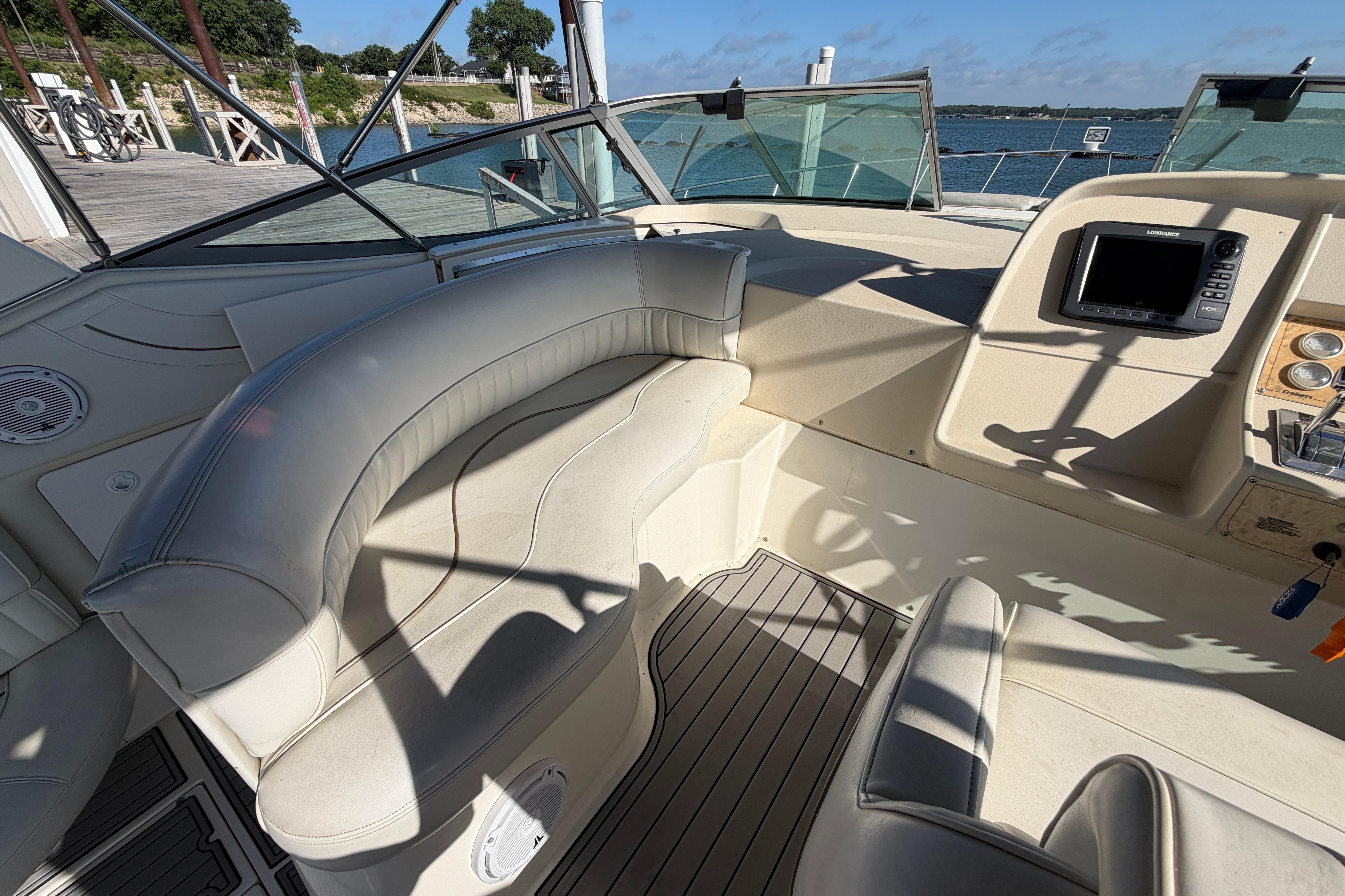 1997 Cruisers 3575 boat interior with leather seating and navigation equipment.