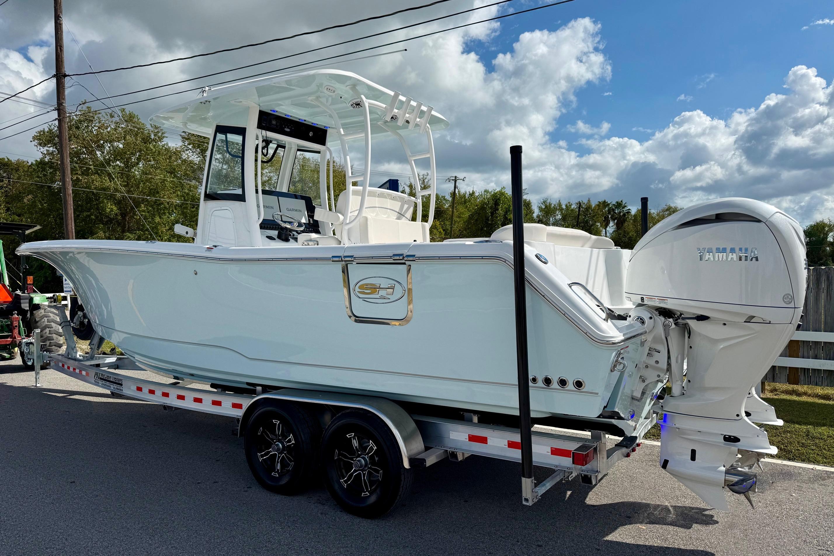 2026 Sea Hunt Ultra 285 Coffin Box boat on trailer, featuring Yamaha outboard motor.