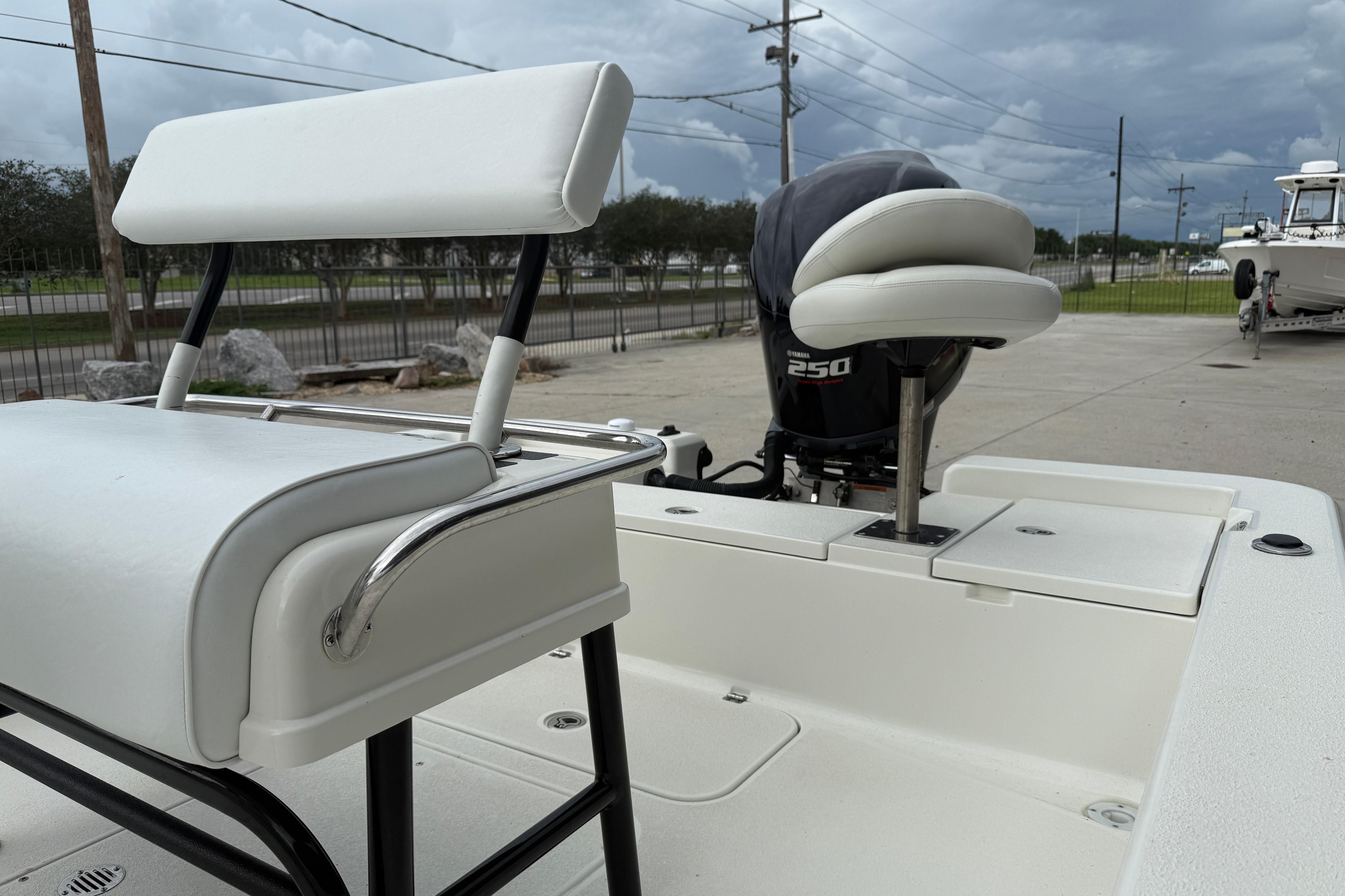 2007 Ranger 2200 Bay Ranger boat with Yamaha 250 engine, featuring white seating and deck.