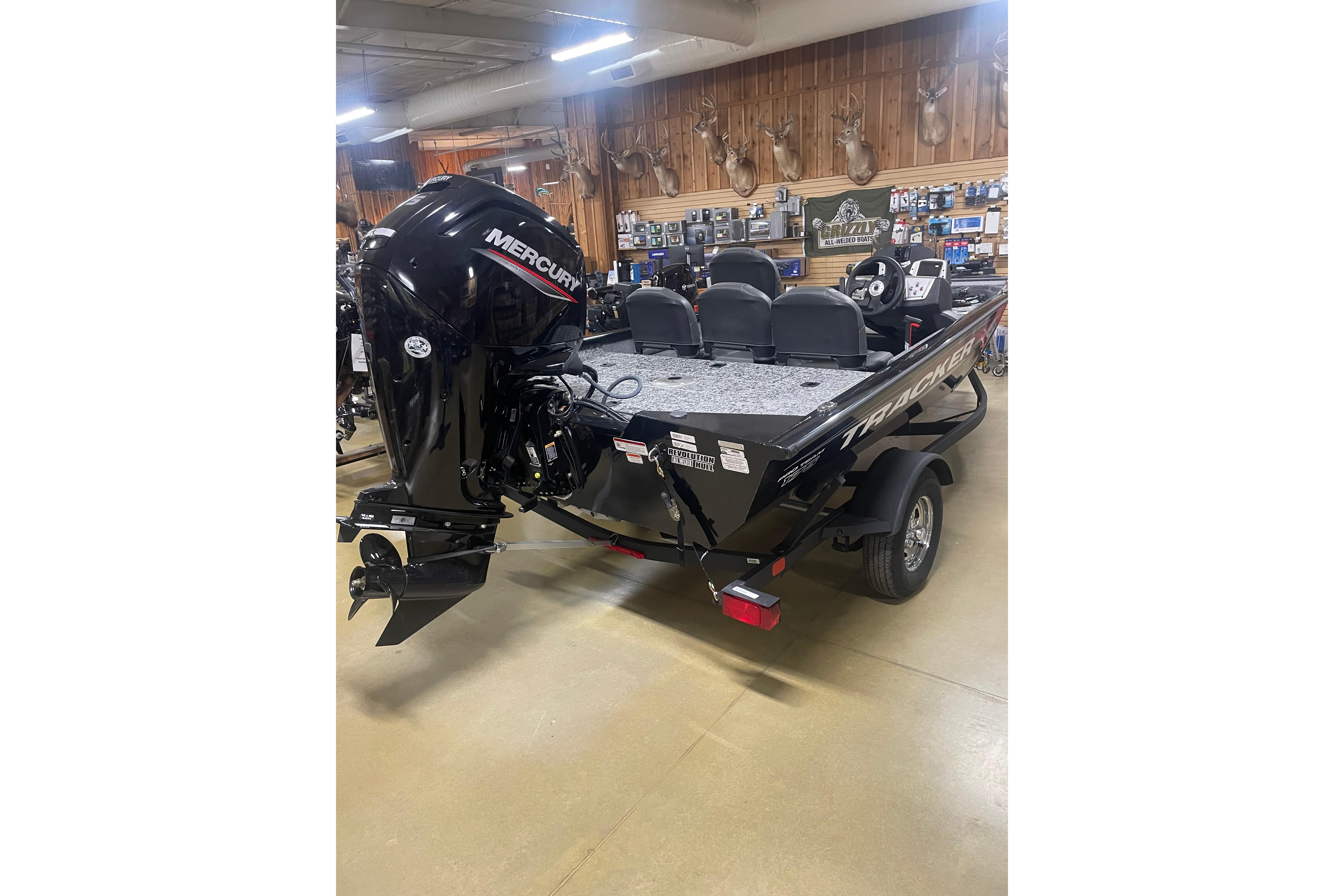 2026 Tracker Pro Team 175 Crappie Edition boat with Mercury engine in showroom.