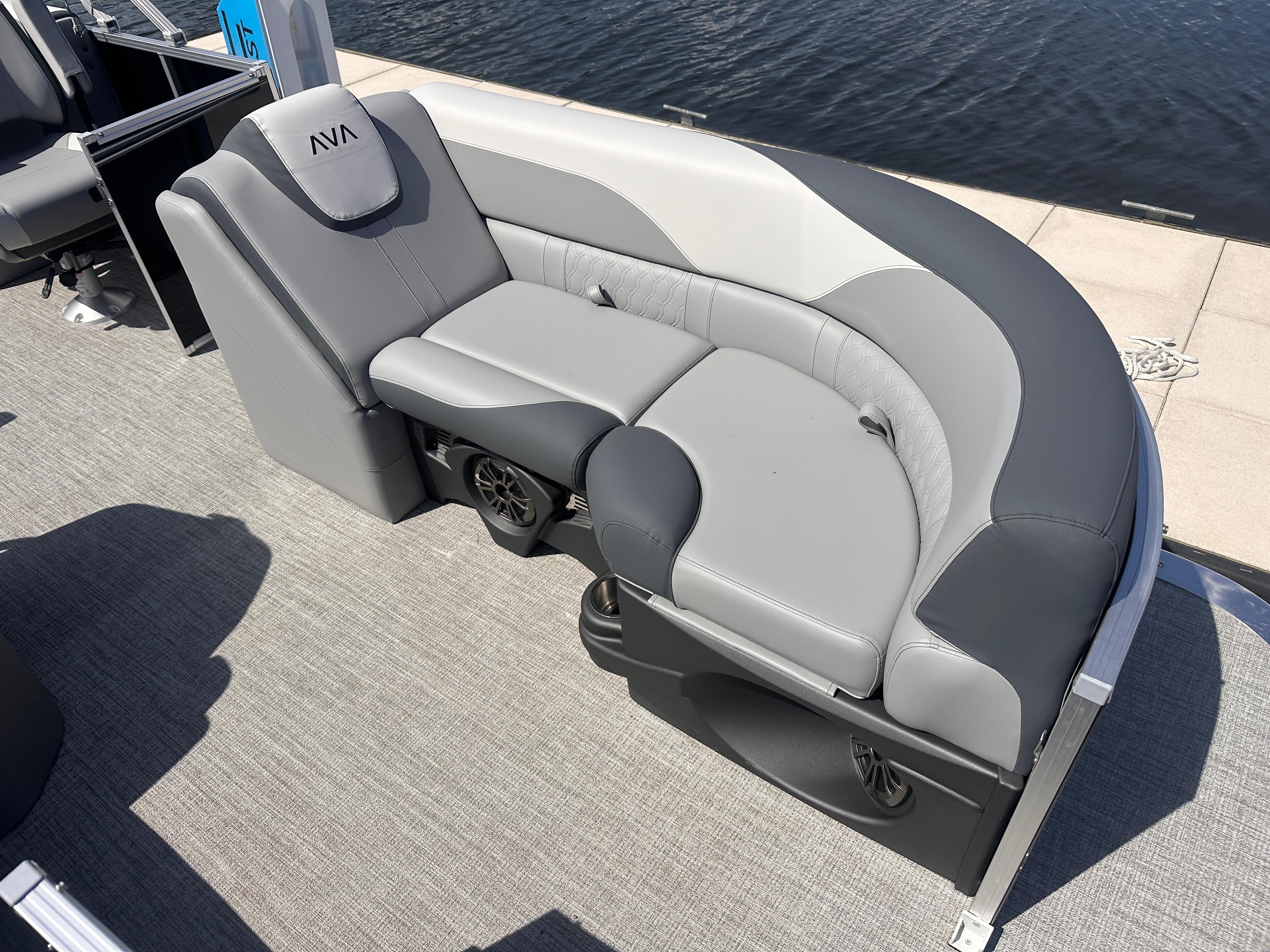 2025 Avalon LSZ Quad Lounger boat seat with gray upholstery by the water.