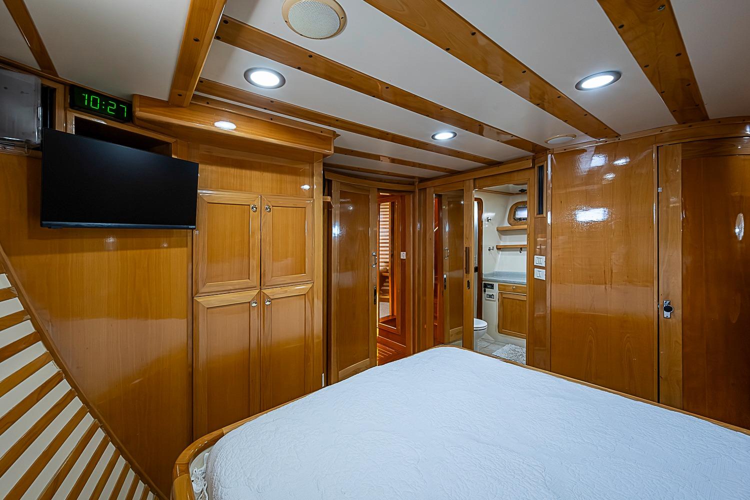 Luxurious 2003 Magna Marine Nova Scotia 47 yacht cabin with wood paneling and modern amenities.