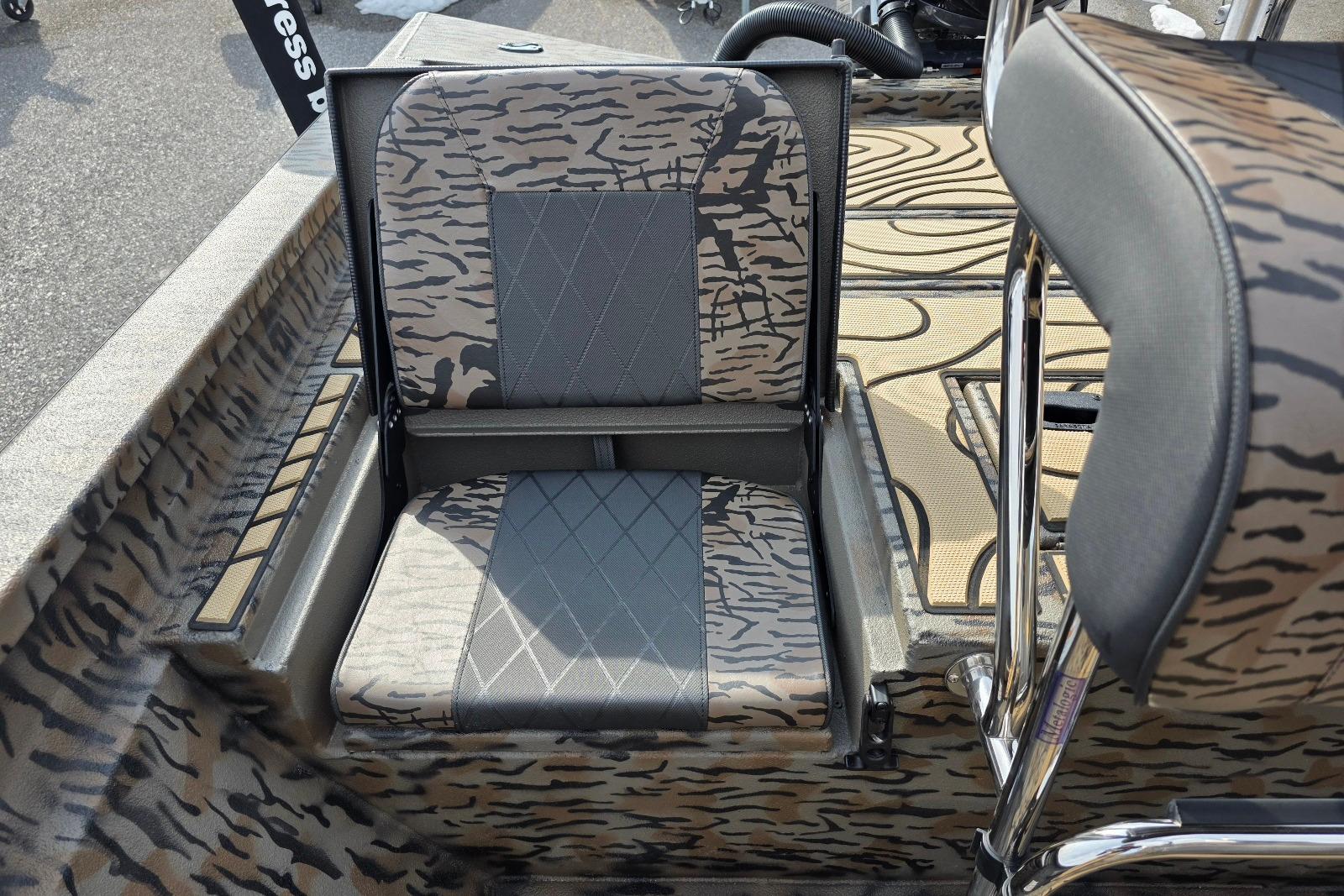 Camouflage seating in 2026 Xpress H22B Bay boat, featuring modern design and comfort.