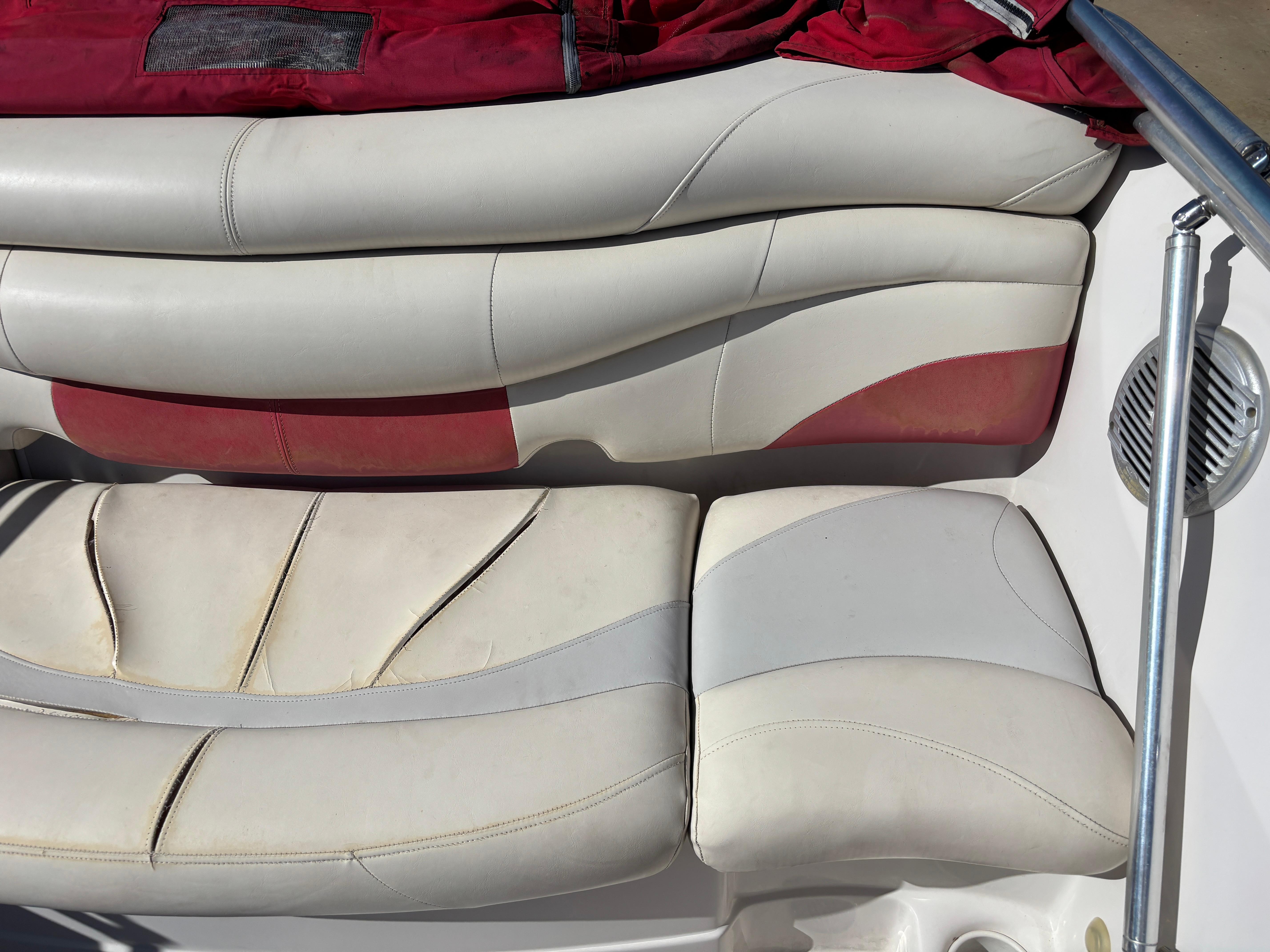 2011 Tracker Tahoe Q5i boat seats with red and white upholstery.