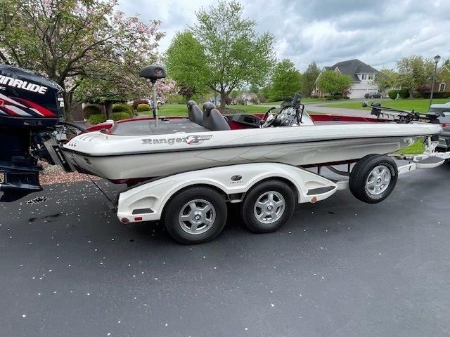 A 2009 Ranger Z520 Comanche on a trailer, parked on a driveway.