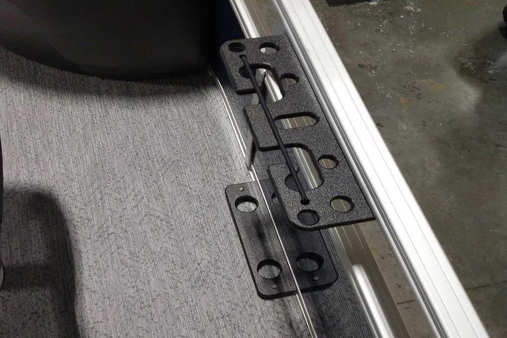 2026 Sun Tracker Bass Buggy 18 DLX boat interior with metal and carpeted flooring detail.