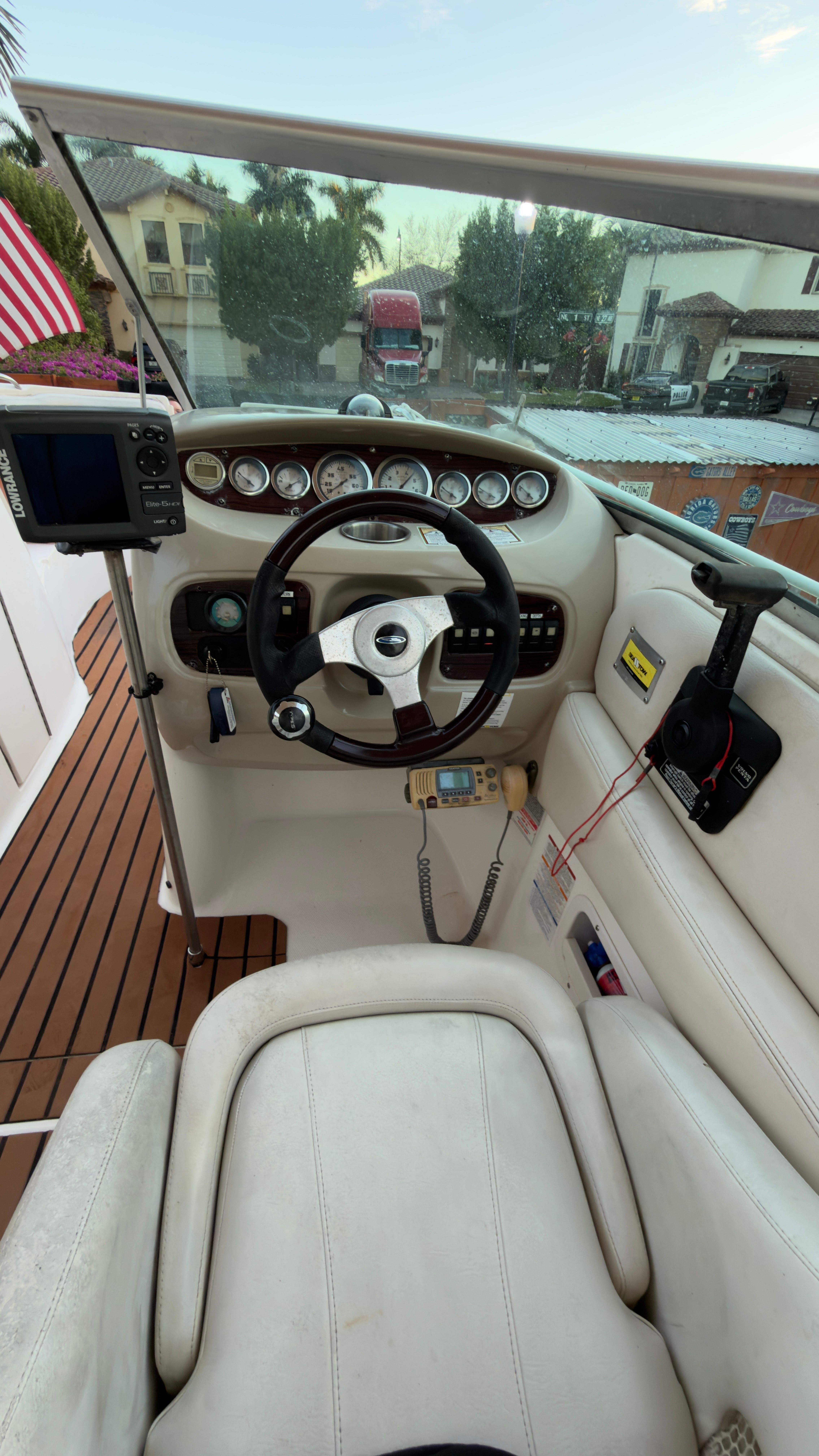 Cockpit of a 2003 Chaparral 263 Sunesta Deckboat with instruments.