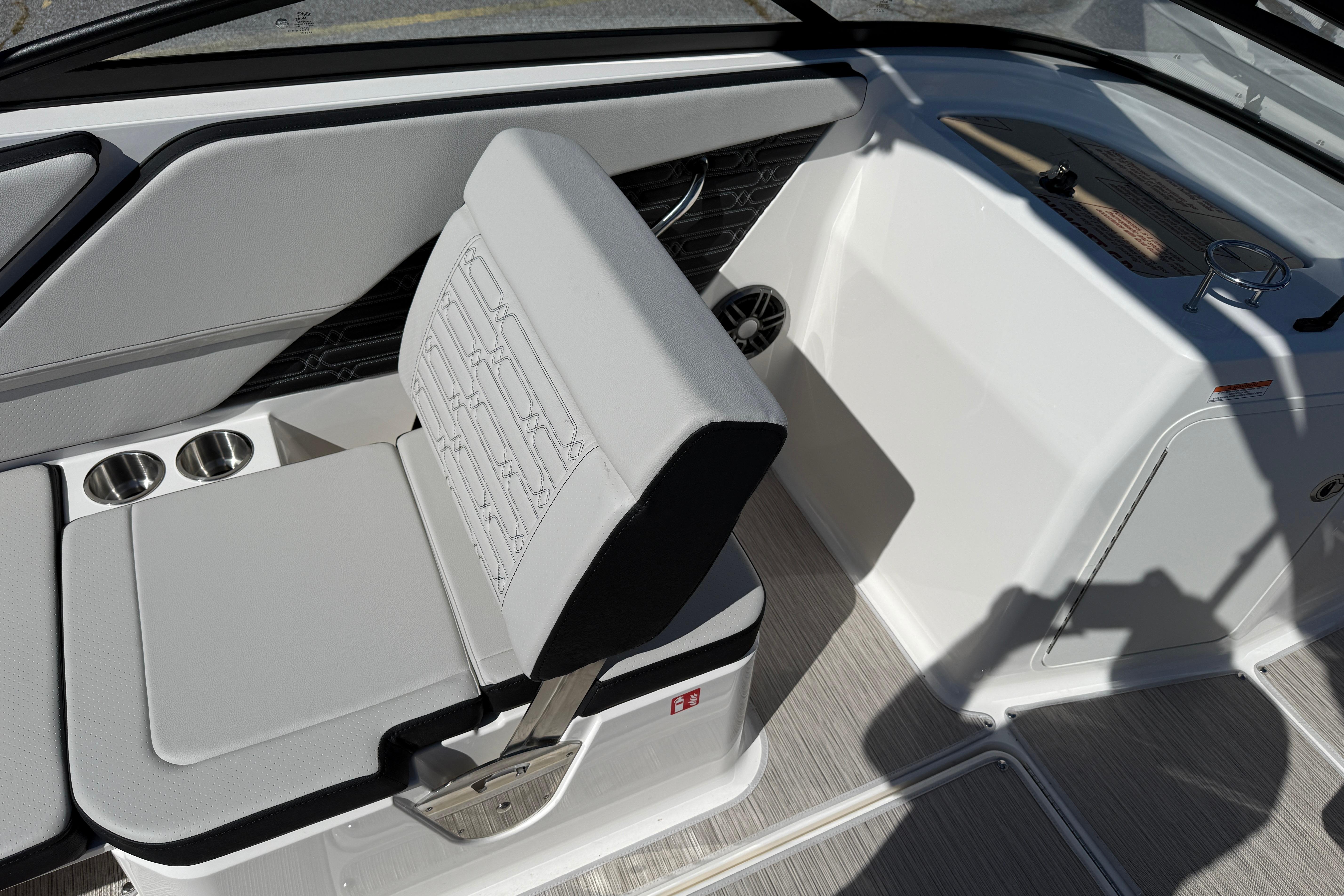 2026 Sea Ray SPX 210 boat interior with cushioned seating and cup holders.