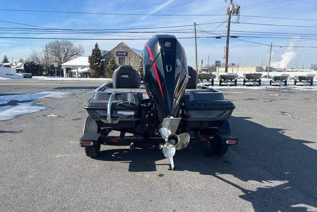 2026 Nitro Z19 XL Pro boat with powerful outboard motor, parked on snowy pavement.