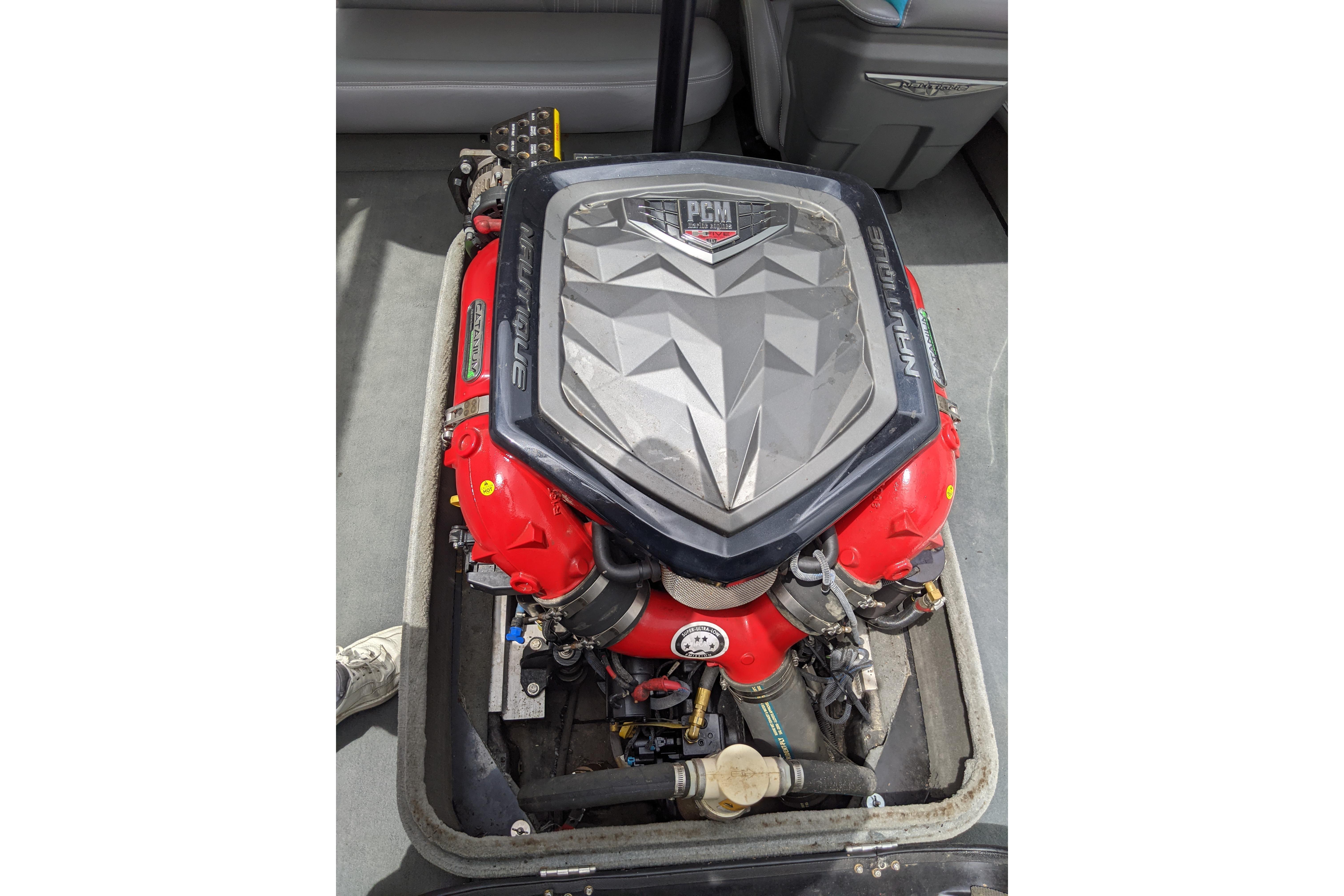 Engine of 2016 Nautique Ski Nautique 200 Closed Bow boat, featuring PCM components.