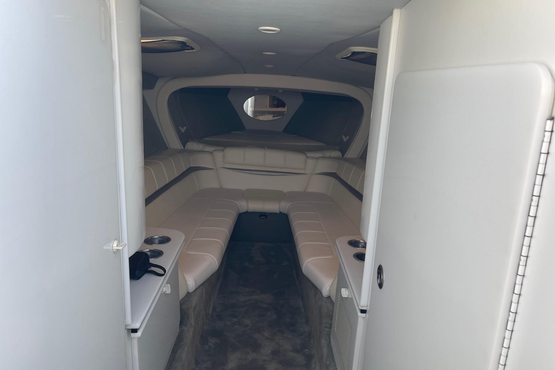 Interior of 2004 Formula 382 FASTech boat, featuring plush seating and modern design.