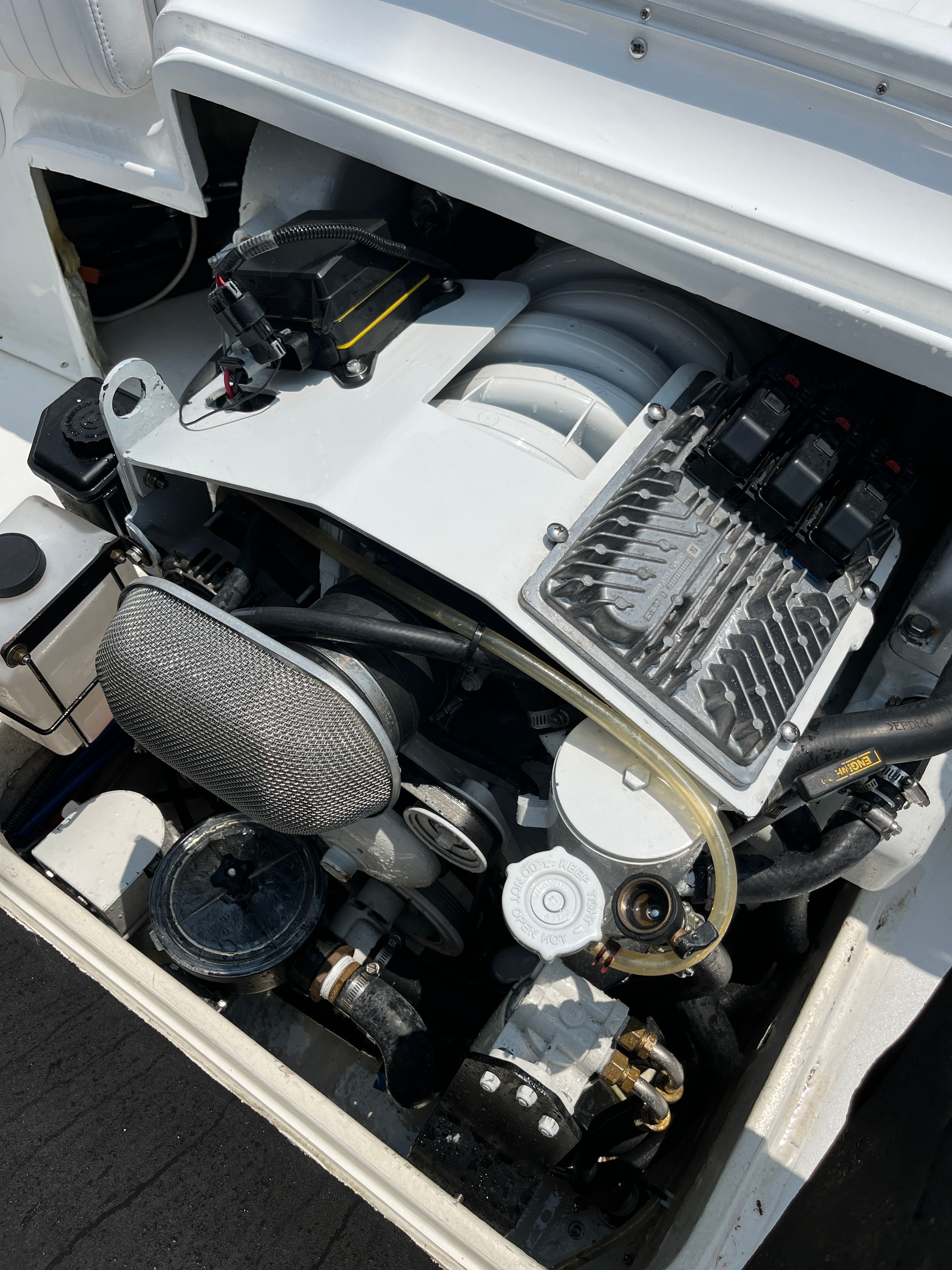 Engine compartment of a 1970 Bertram Sportsman boat, detailed view.
