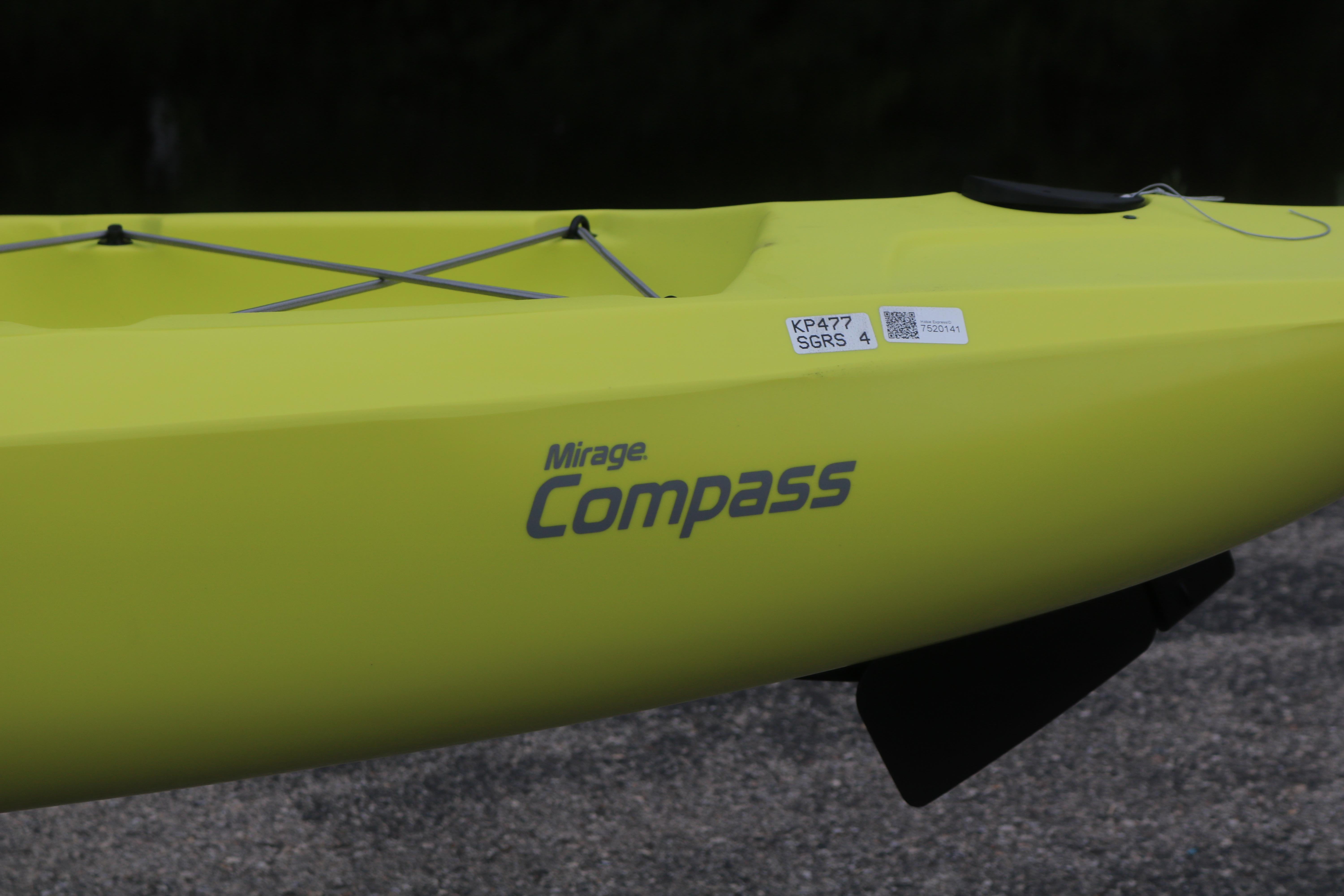 2025 Hobie Mirage Compass kayak in vibrant yellow, featuring sleek design and branding.
