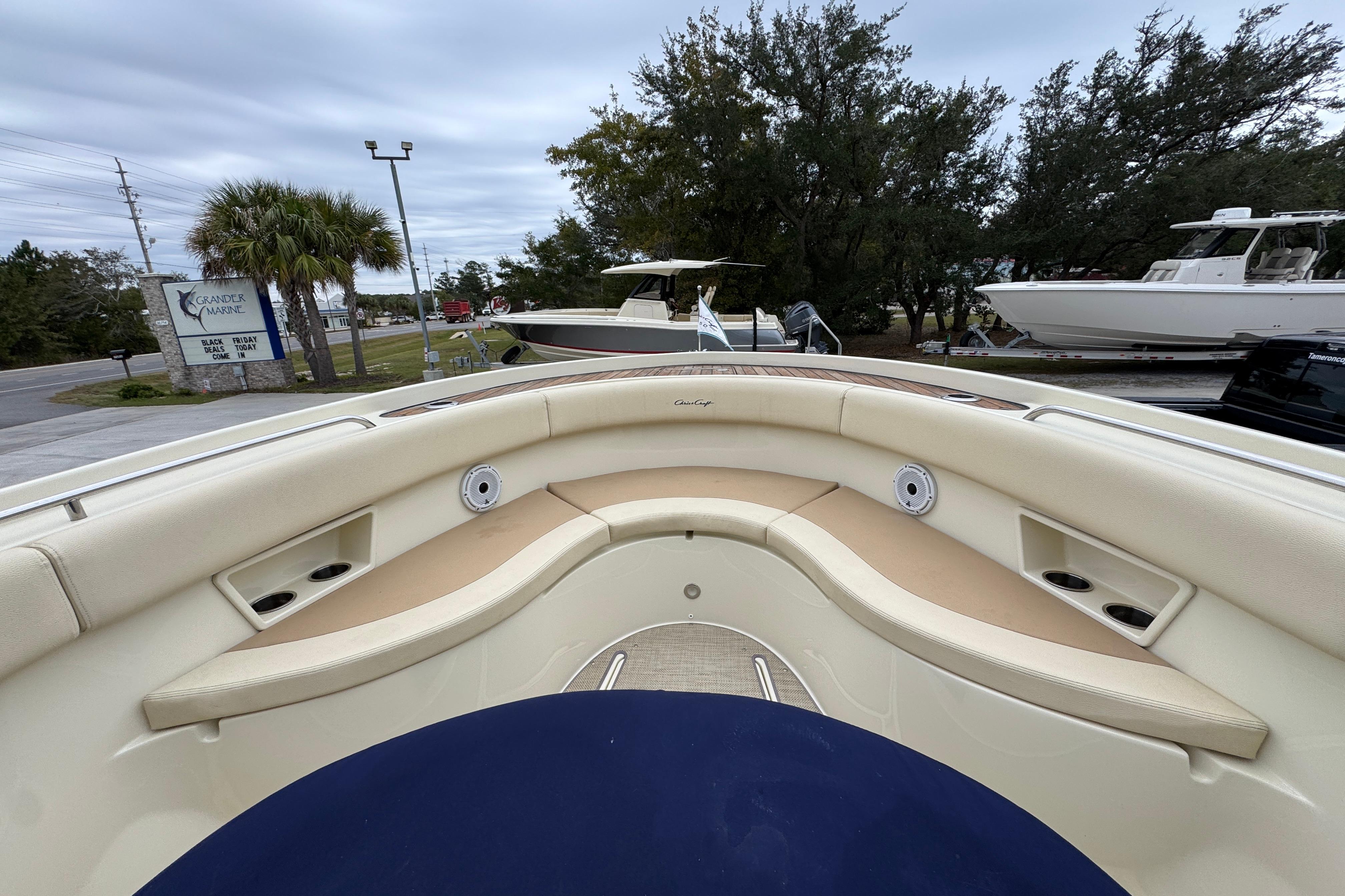 2020 Chris-Craft Catalina 30 boat interior with beige seating and cup holders.