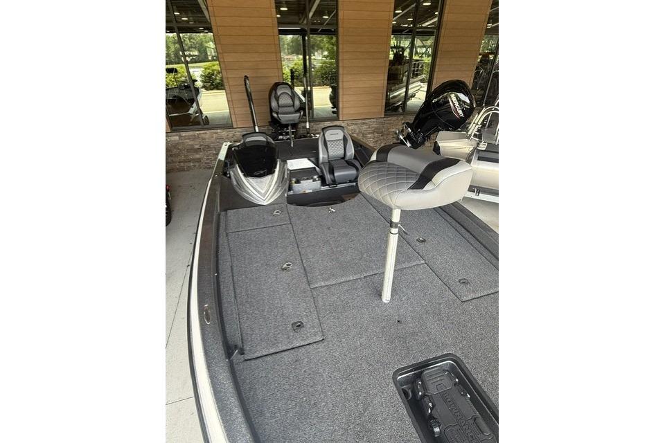 2023 Caymas CX 21 PRO boat interior with seating and storage compartments.