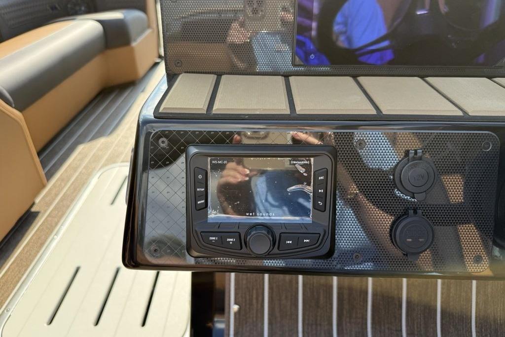 Control panel of 2026 Premier 250 Solaris RS CL boat with audio system.