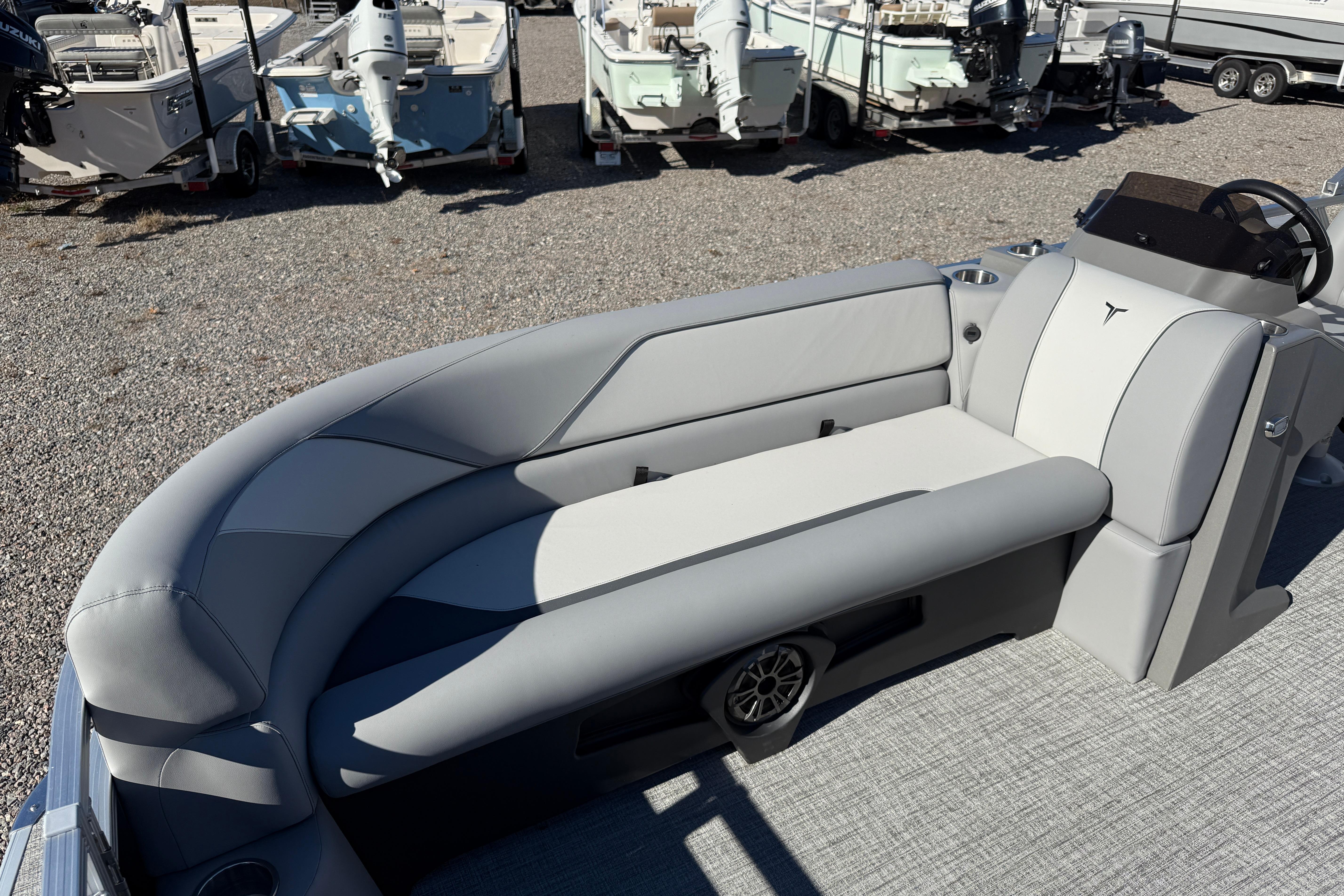 2026 Tahoe Pontoon Sport 85 Rear Fish boat interior with gray seating and steering console.