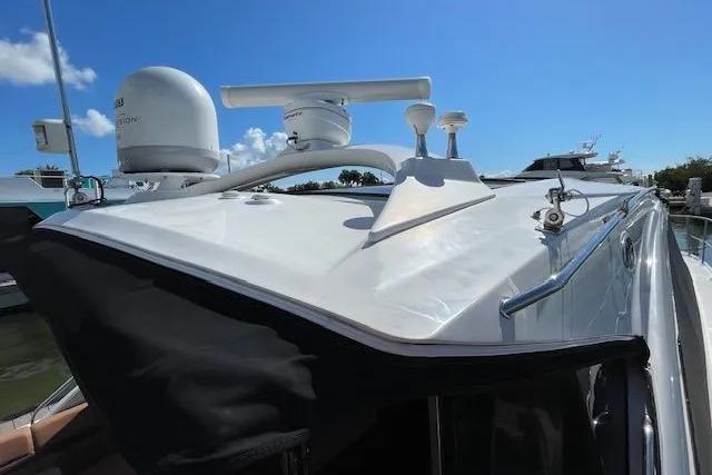 2016 Sea Ray Sundancer 510 yacht with radar equipment under clear blue sky.