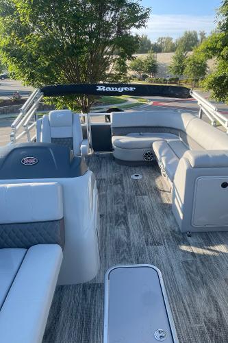 2024 Ranger Reata 223C pontoon boat interior with seating and helm.