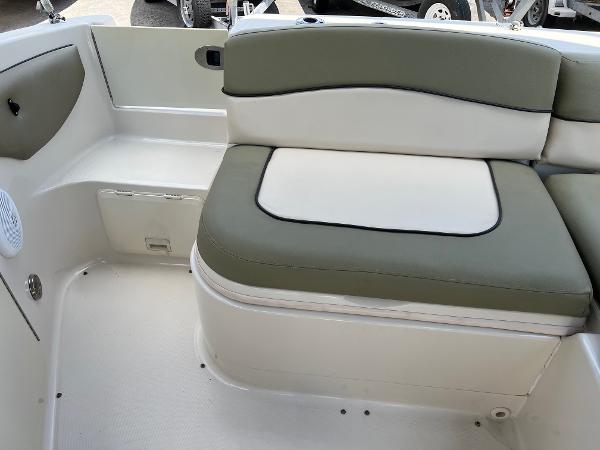 2005 Sea Ray 220 Sundeck interior seating with green and white upholstery.