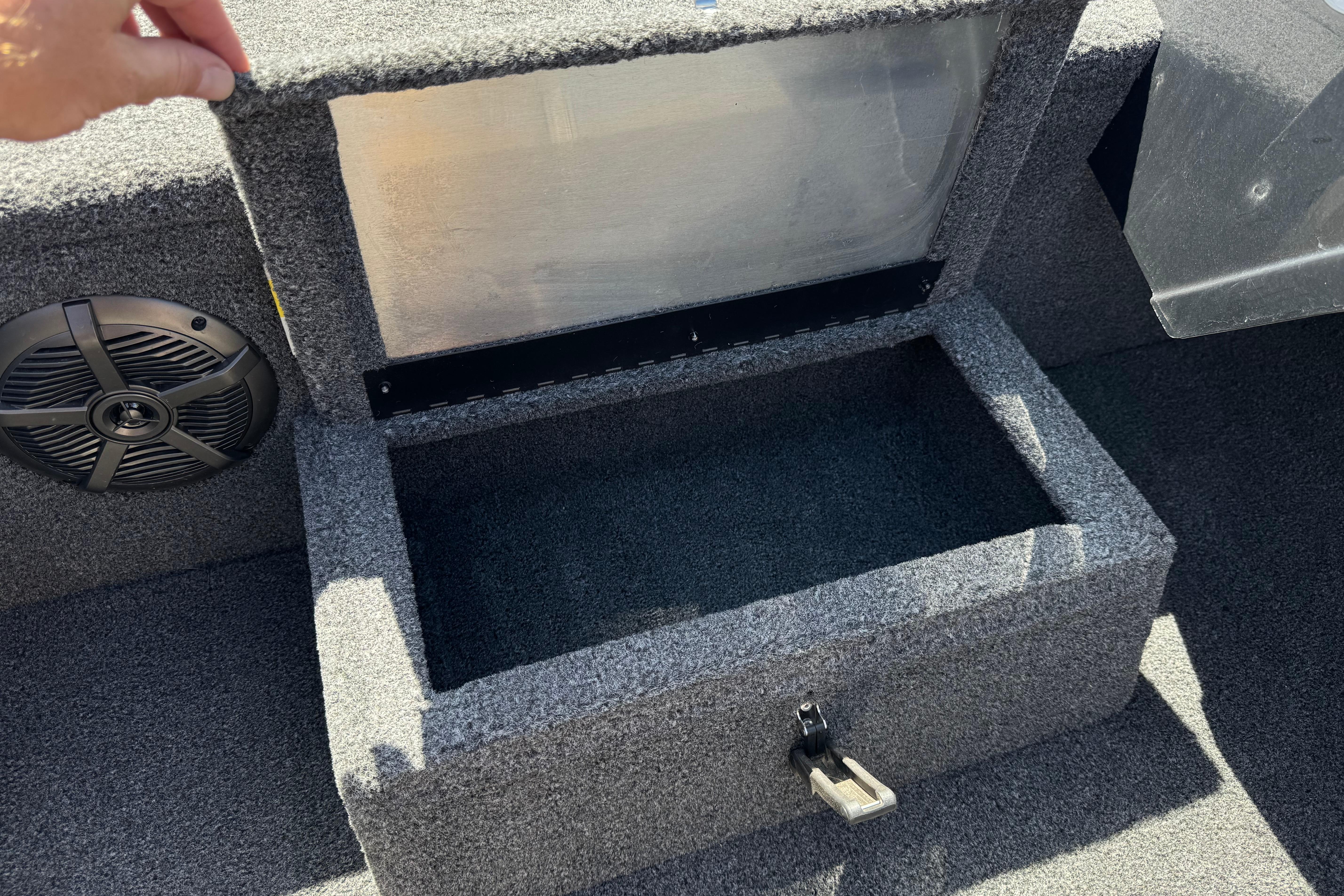 2024 Lowe Stinger 175 boat storage compartment with speaker, open lid view.