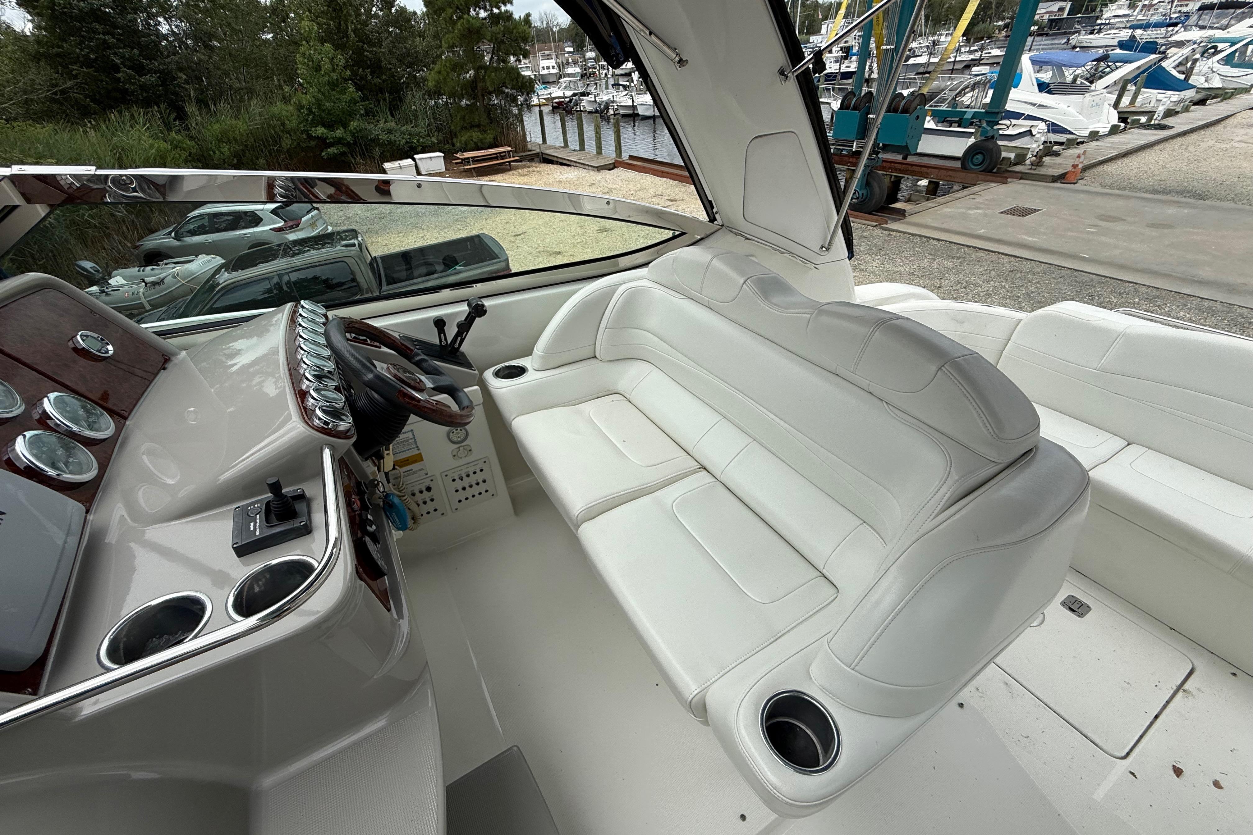 2003 Formula 37 PC boat interior with white seating and control panel.