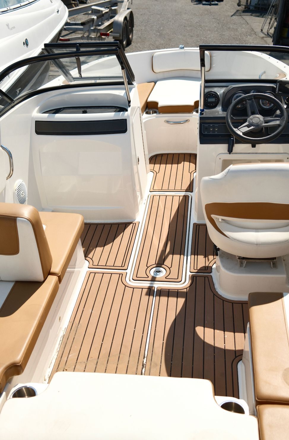 The image shows the cockpit of a 2019 Bayliner VR4 Bowrider OB with brown seating.