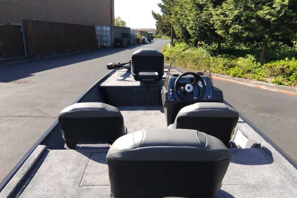 2026 Tracker Bass Tracker Classic XL boat interior with seating and steering console.
