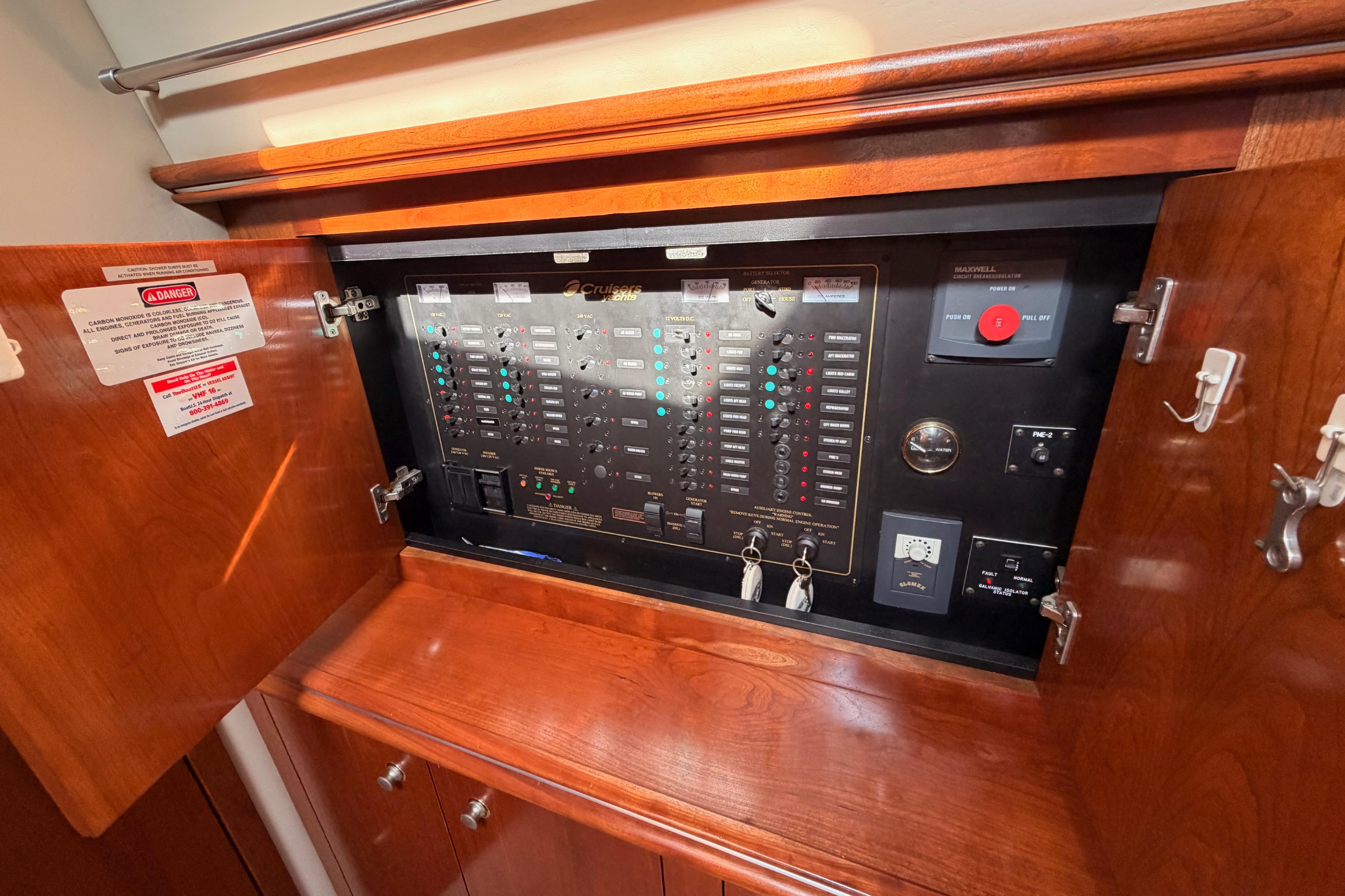 Electrical panel inside 2005 Cruisers Yachts 405 Express Motoryacht, featuring switches and controls.