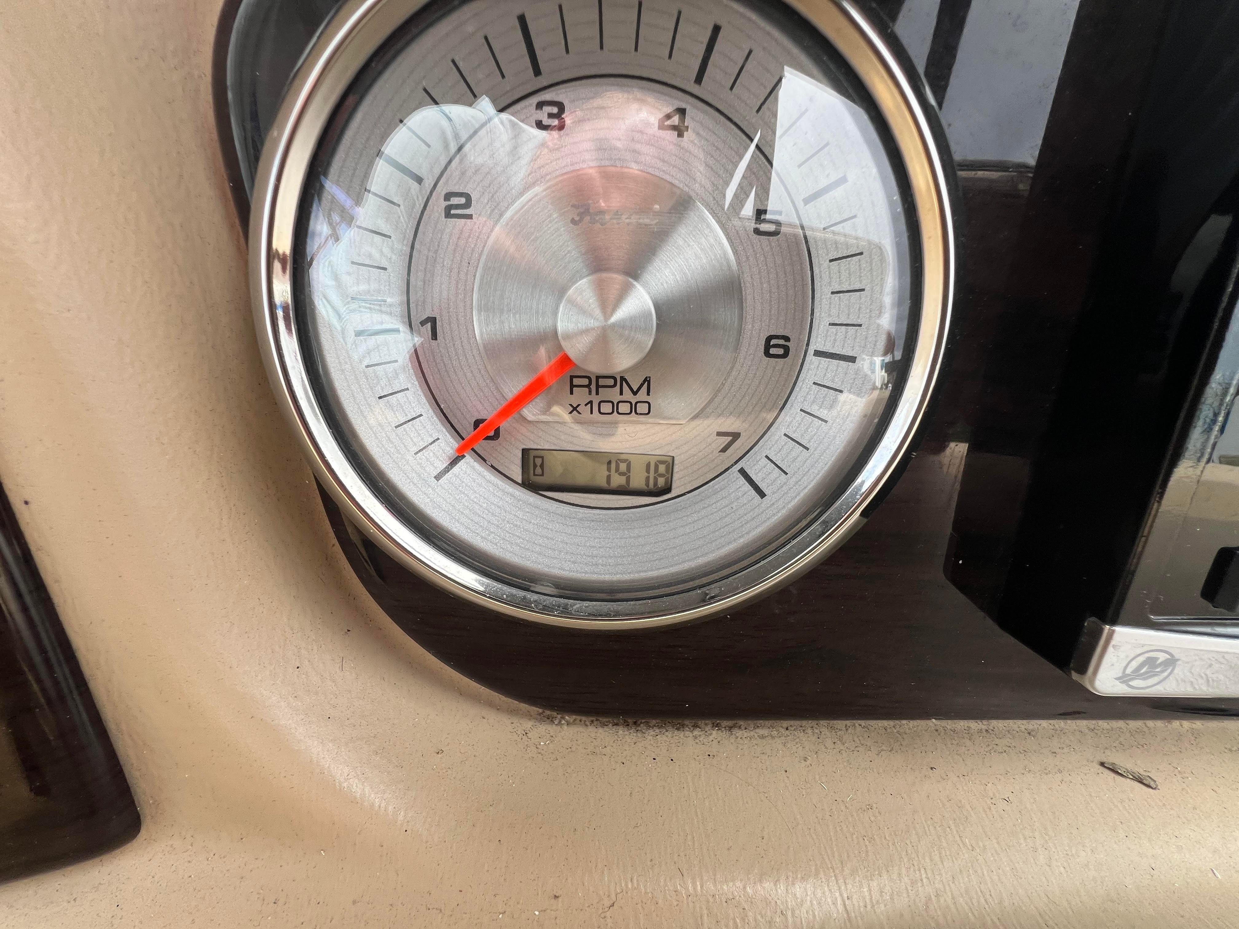 Tachometer of a 2015 Harris FloteBote Grand Mariner SL 250 boat.