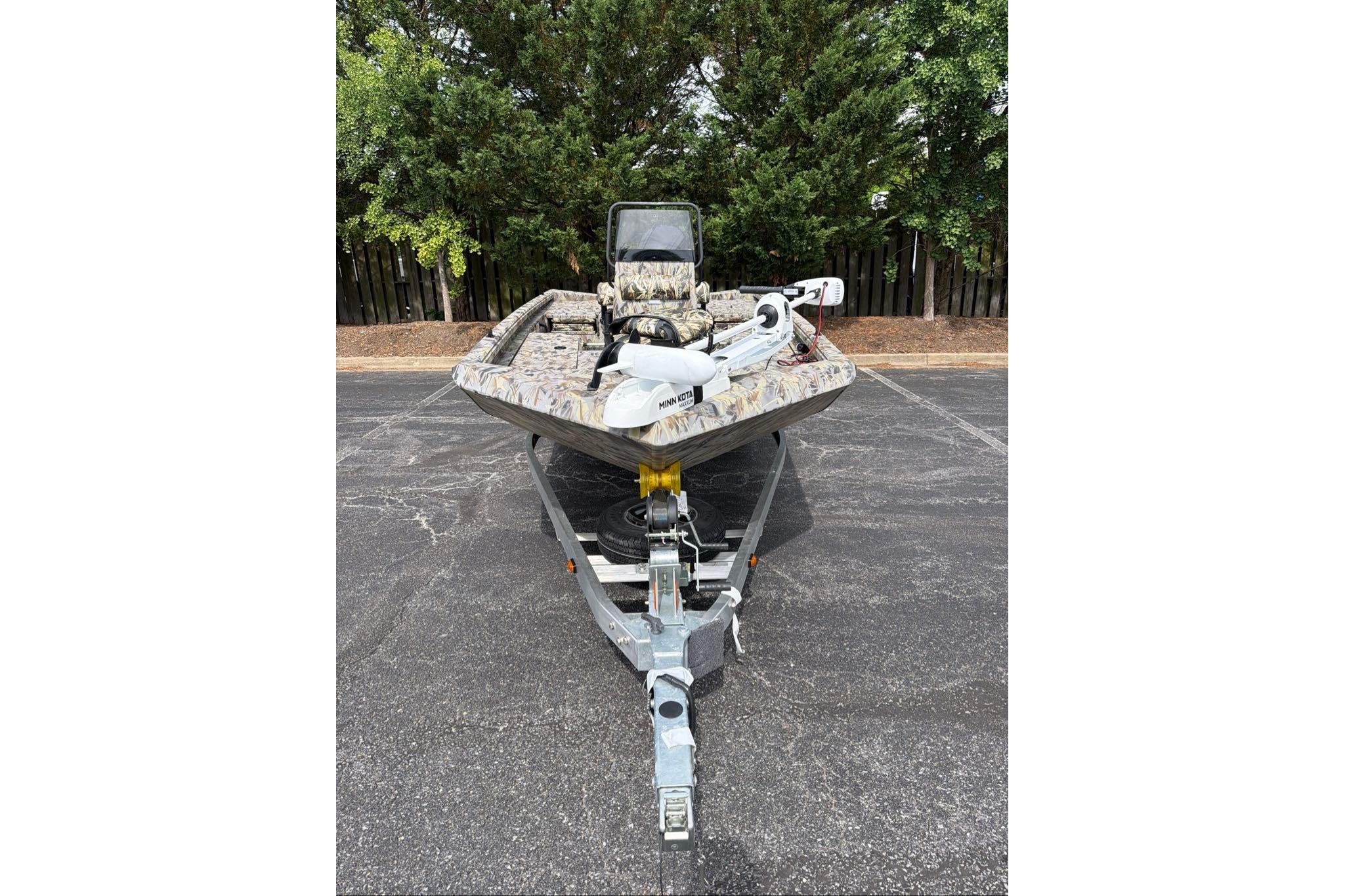 2026 Ranger RB190 boat on trailer, camo design, parked outdoors.