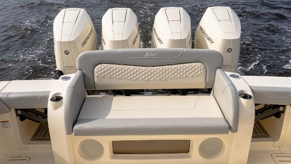 2025 Scout 425 LXF boat with four Mercury engines, featuring a luxurious rear seating area.