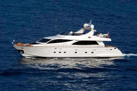 Luxury Falcon 90 yacht cruising on open sea, 2006 model.