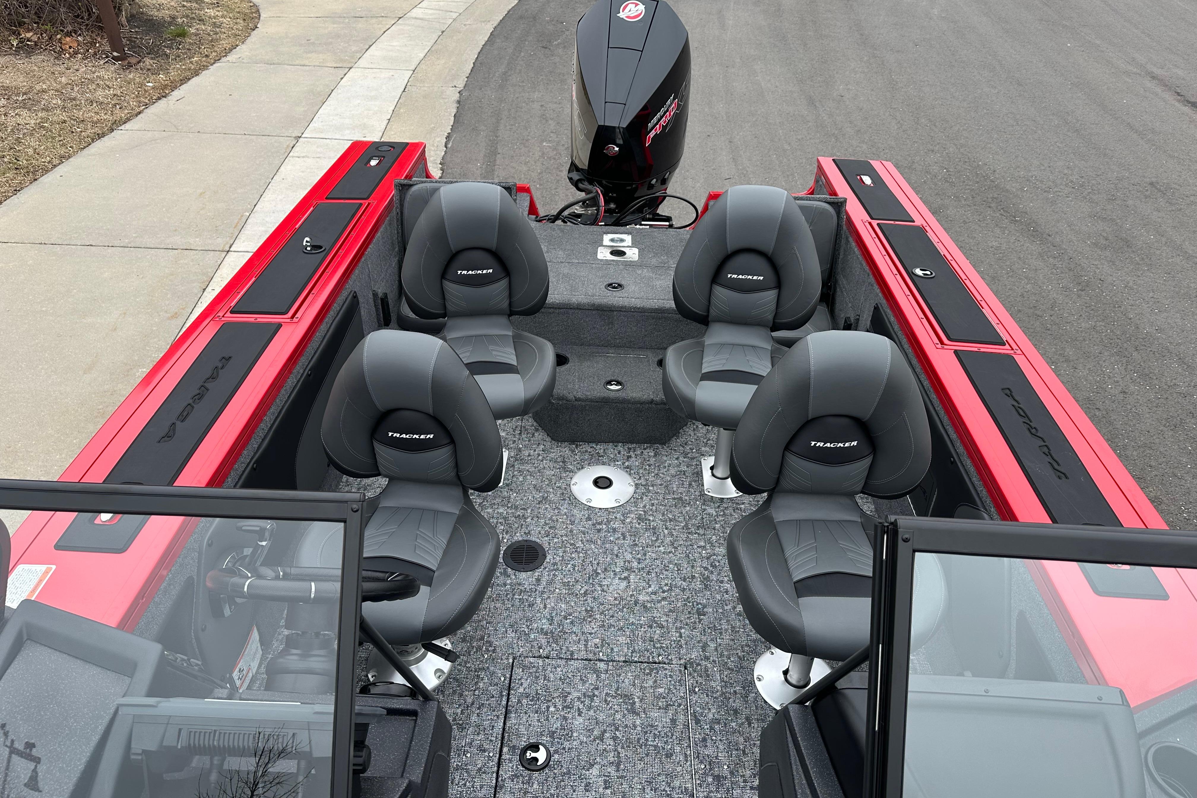2026 Tracker Targa V-19 Combo boat interior with four seats and red accents.
