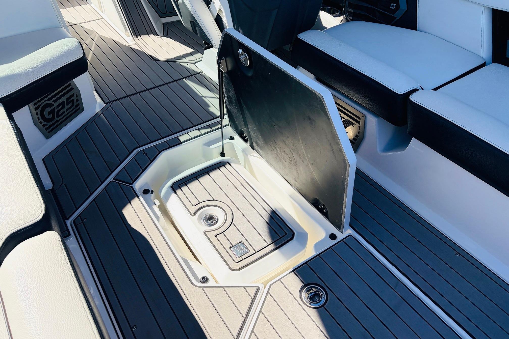 2023 Nautique Super Air Nautique G25 interior with open storage compartment.