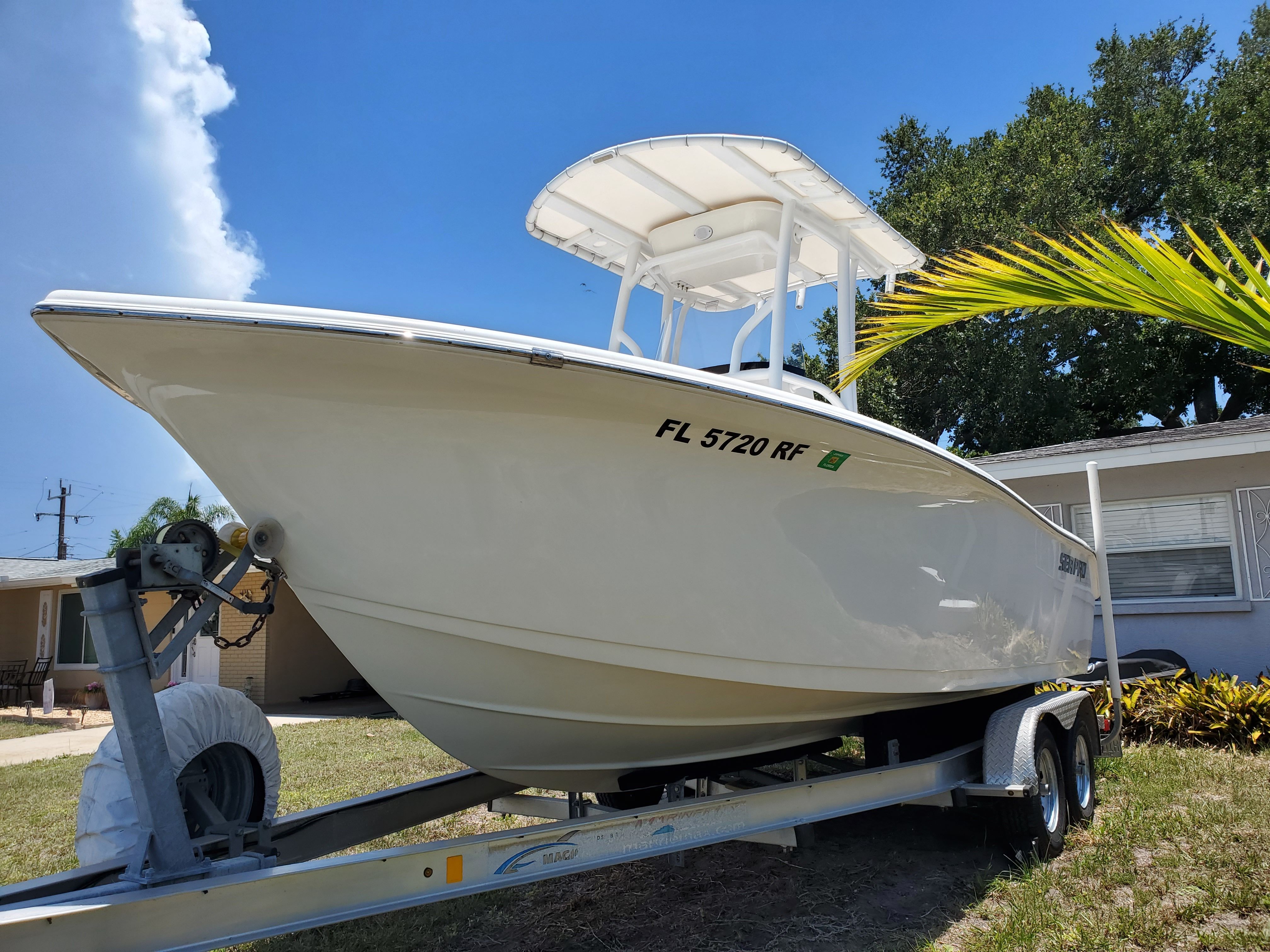 2017 Sea Pro 219 Center Console on a trailer in front of a house.