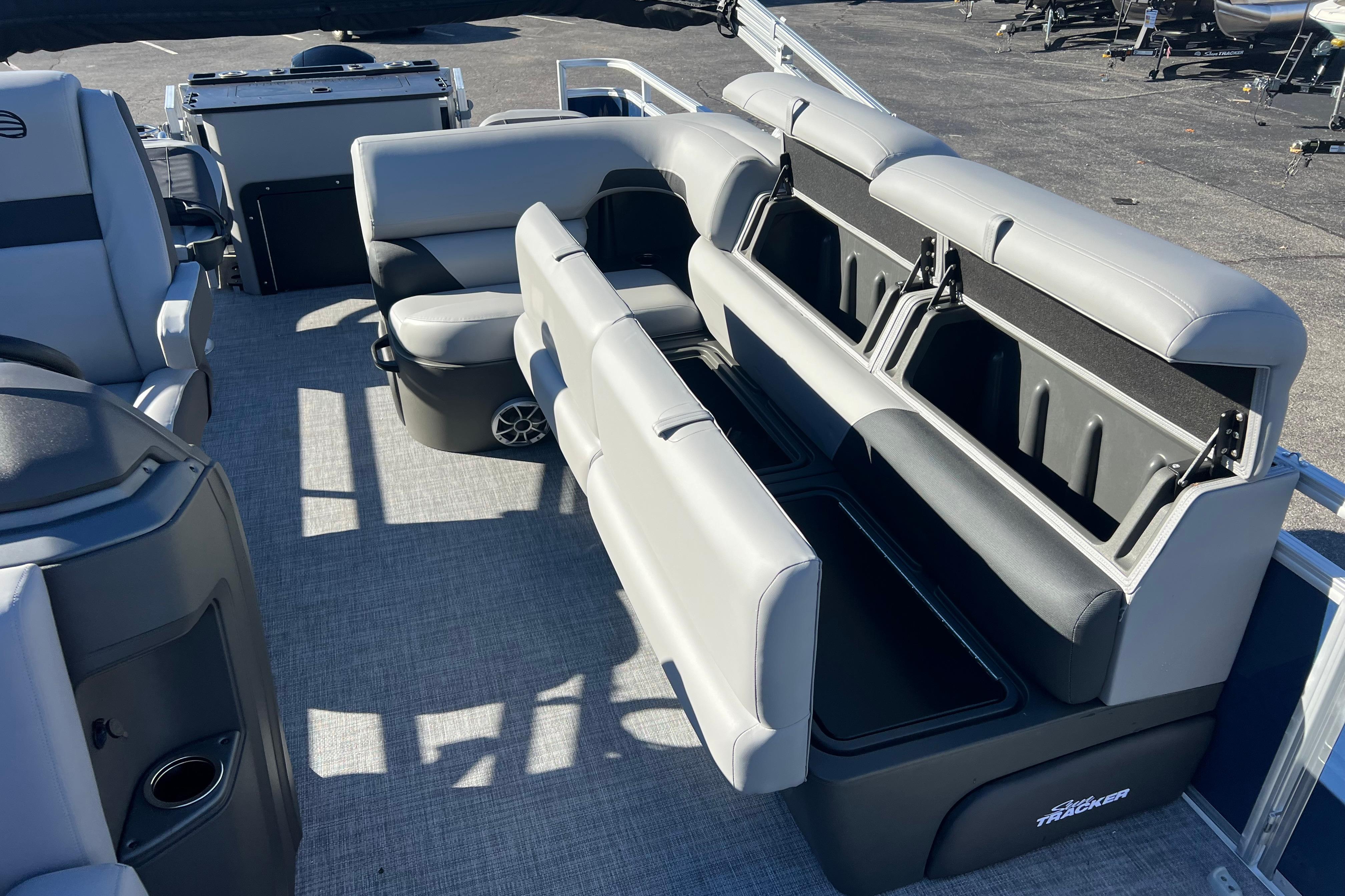2026 Sun Tracker Sportfish 24 XP3 interior with spacious seating and storage compartments.