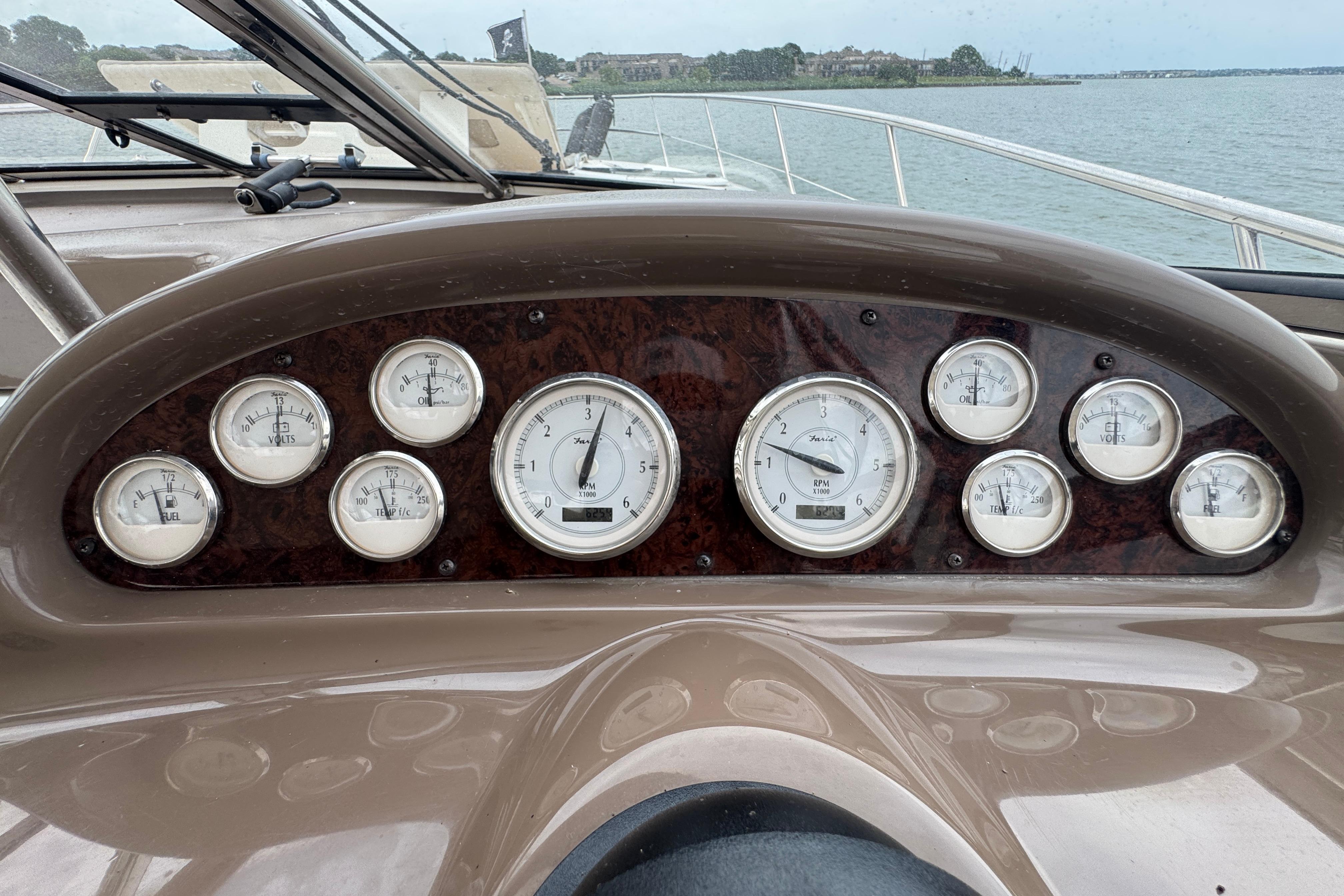 Dashboard of a 2005 Regal Commodore 4260 boat with various gauges and controls.