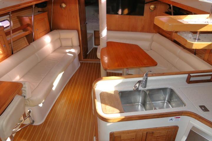 Interior of 2008 Catalina 400 MK II yacht with spacious seating and modern kitchen area.
