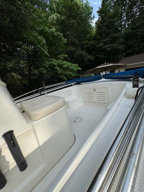 2006 Mako 171 Center Console boat in a wooded area.