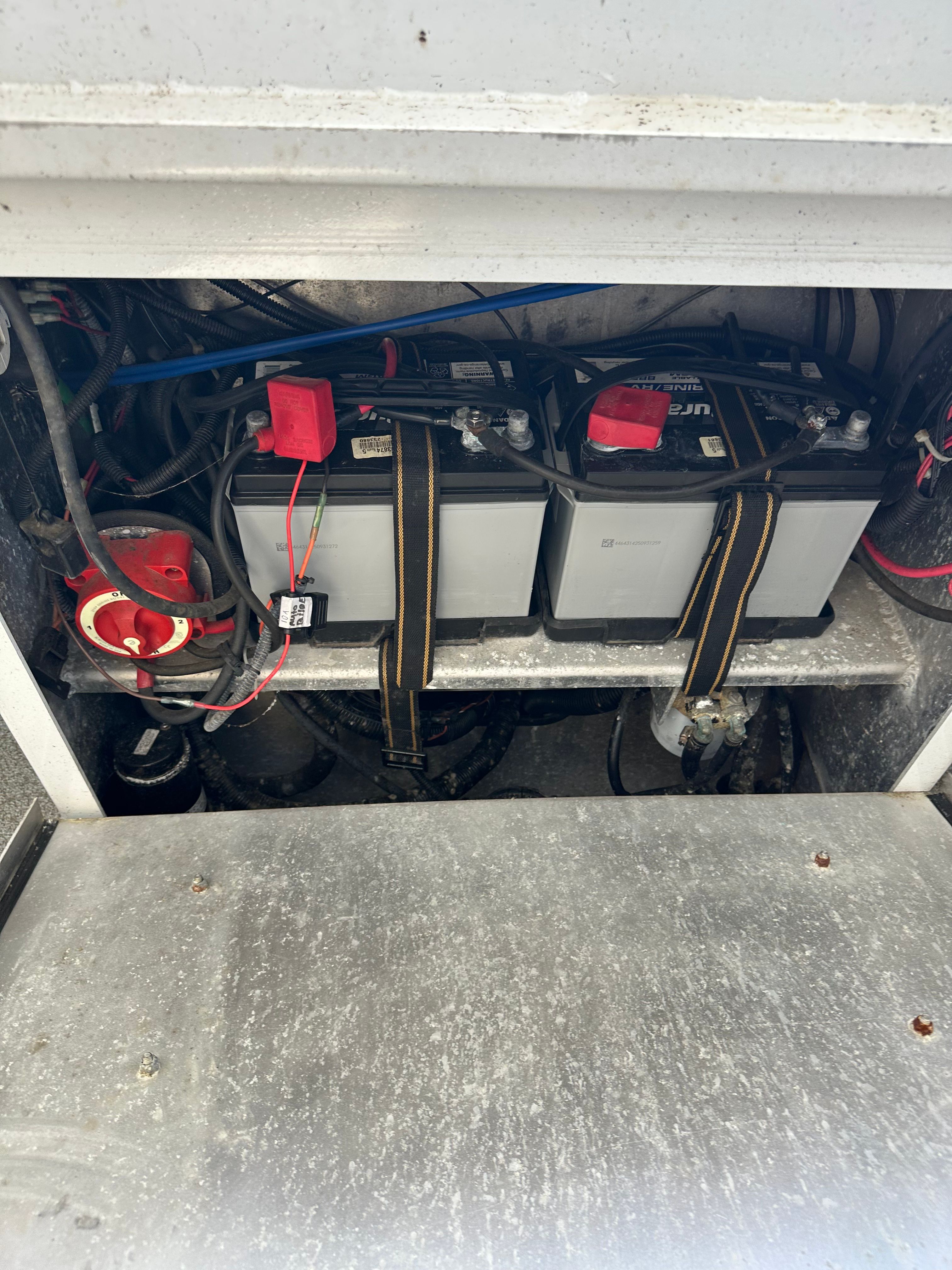 Batteries securely strapped in a 2006 North River Aluminum boat.