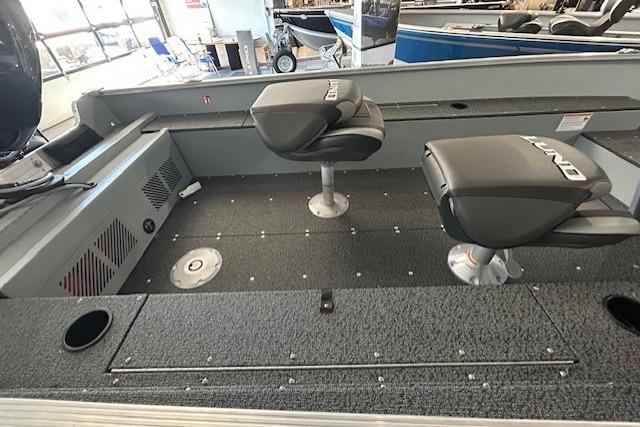 2027 Lund 1600 Fury SS boat interior with two swivel seats and carpeted deck.