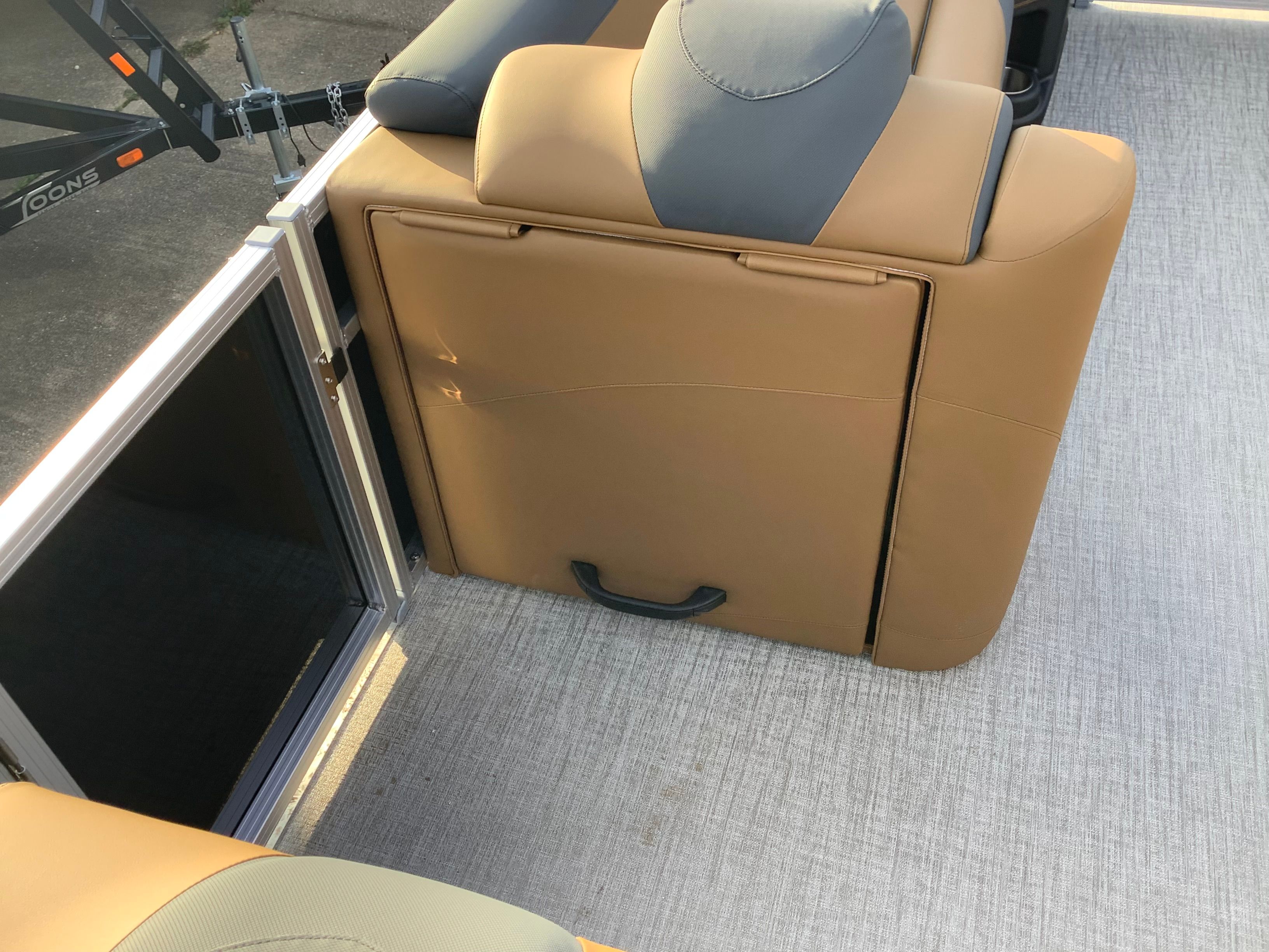 Interior of 2026 Tahoe 2385 LTZ with beige seat and gray flooring.