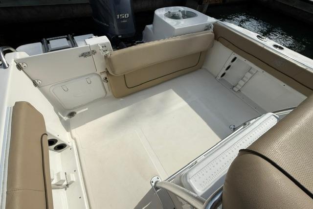 2019 NauticStar 20 XS boat interior with beige seating and spacious deck area.