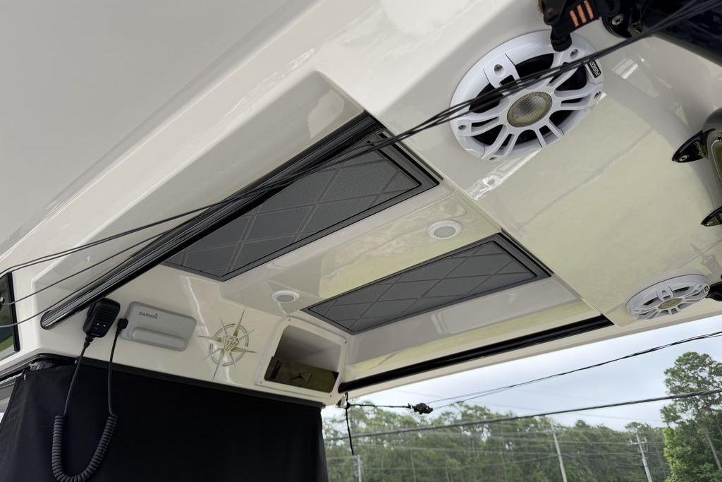 2023 Stingray 273 CC boat interior with speakers and electronic equipment.