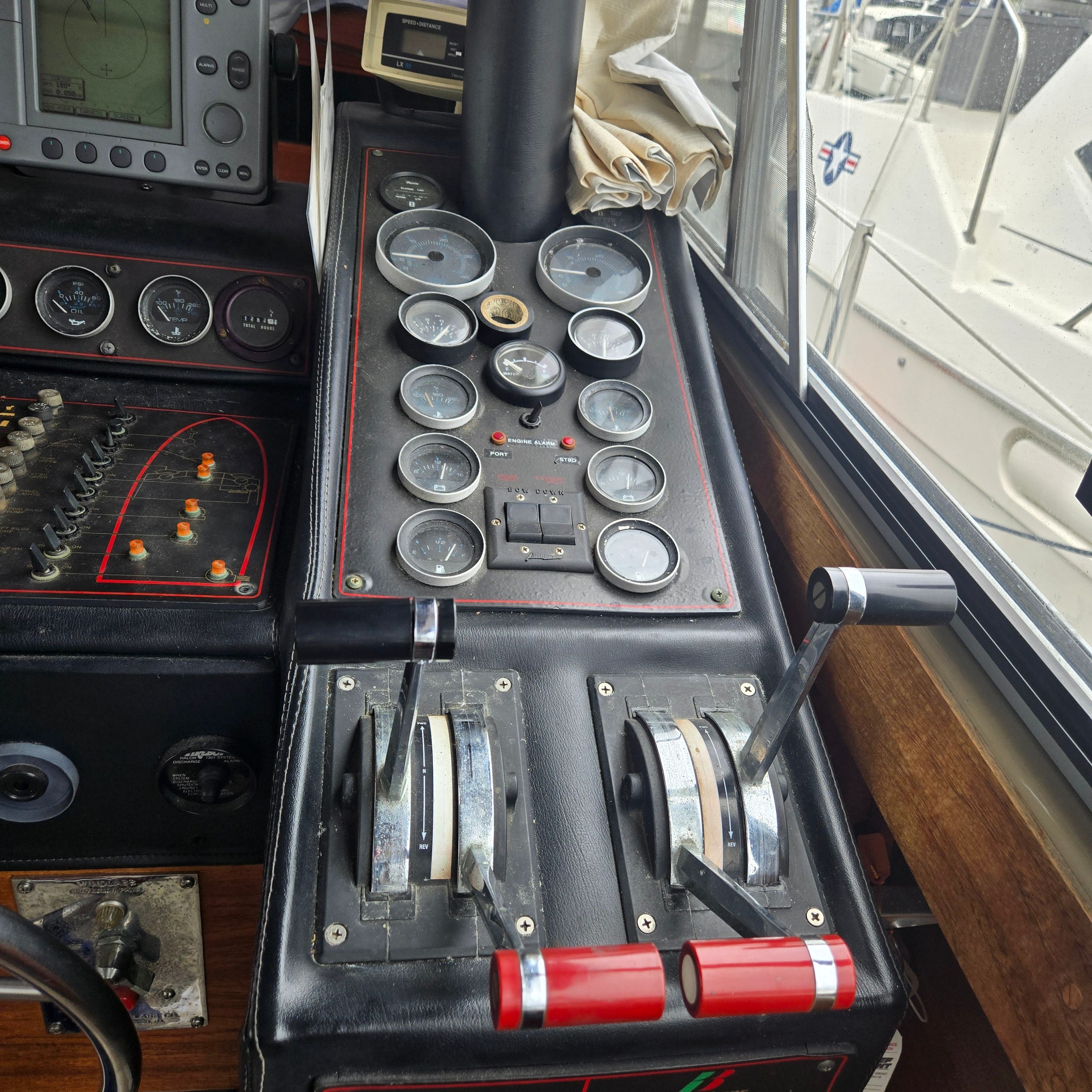 1984 Bayliner 3870 Motoryacht dashboard with control levers and gauges.