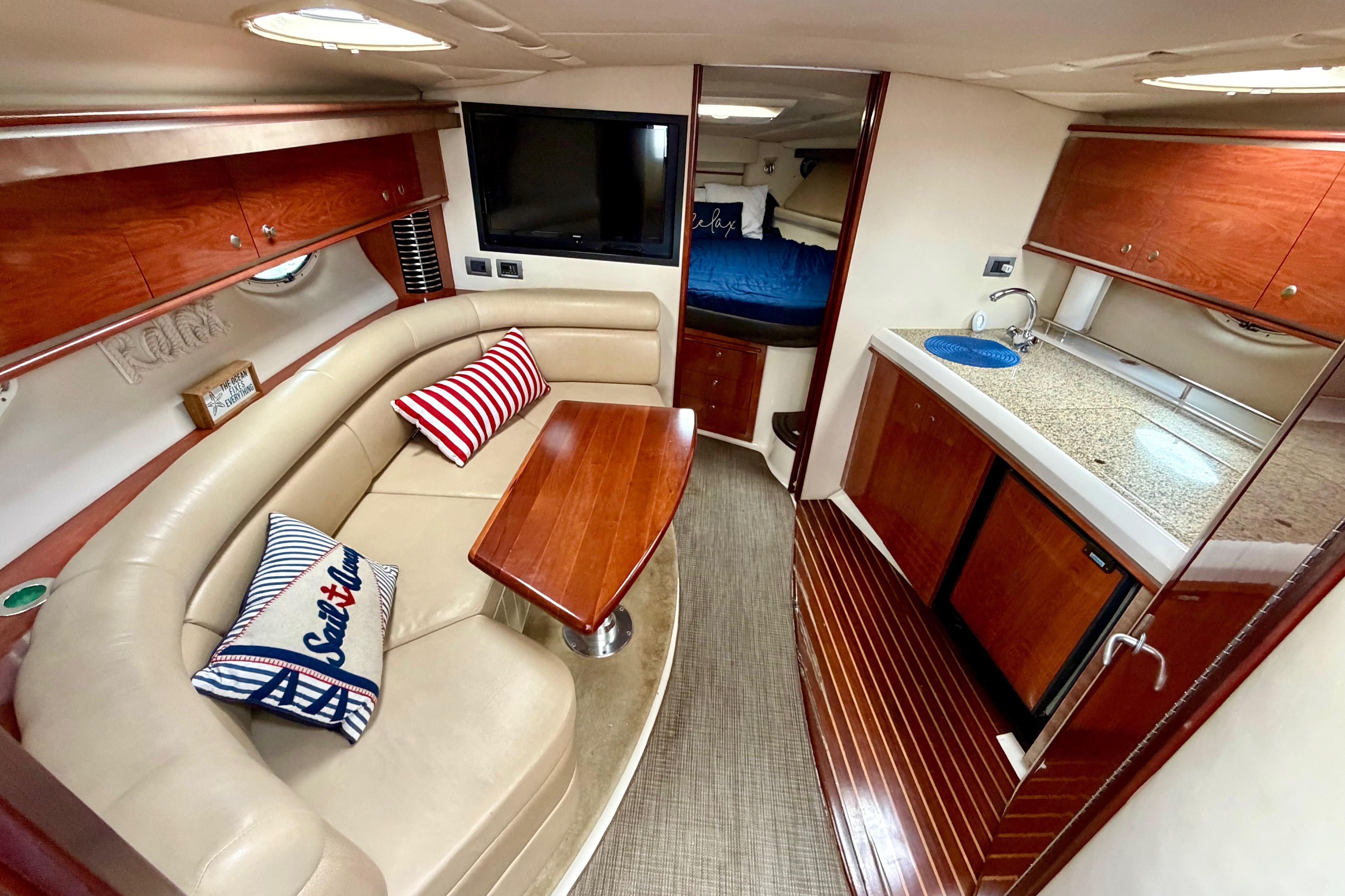 Luxurious interior of 2007 Monterey 350 Sport Yacht with cozy seating and modern amenities.